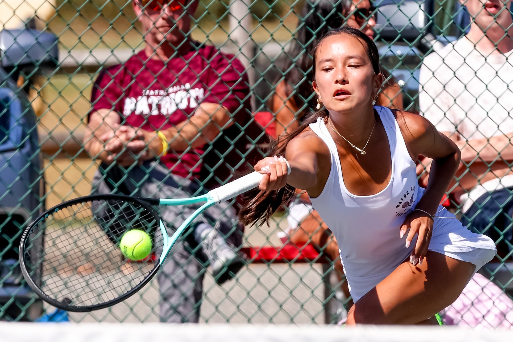 Emma Grealy of Wayne Hills returns a shot against Passaic Tech during the third singles match of the girls tennis Passaic County Final at Hershfield Park in Pompton Lakes, NJ on Friday, September 19, 2025.