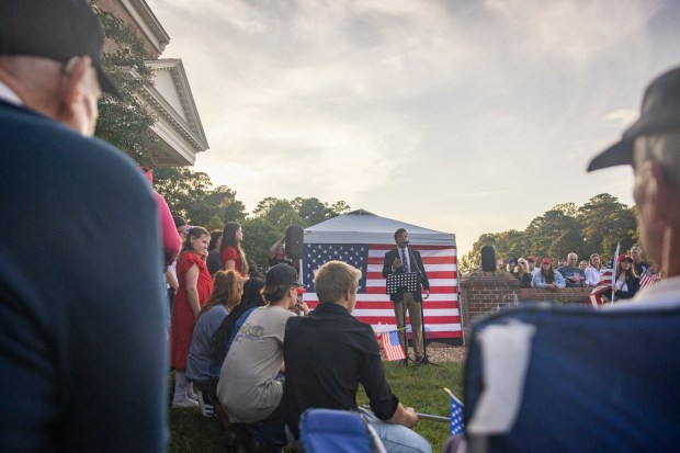 Trevor Topping, who helped organize the event, speaks before a...