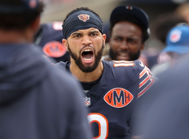 Bears quarterback Caleb Williams celebrates a touchdown pass to wide receiver Luther Burden III on a trick play against the Cowboys in the first quarter on Sept. 21, 2025, at Soldier Field. (Brian Cassella/Chicago Tribune)