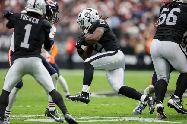 Raiders running back Ashton Jeanty (2) eludes the Bears defense en route to a 64-yard touchdown in the second quarter at Allegiant Stadium on Sept. 28, 2025, in Las Vegas. (Armando L. Sanchez/Chicago Tribune)