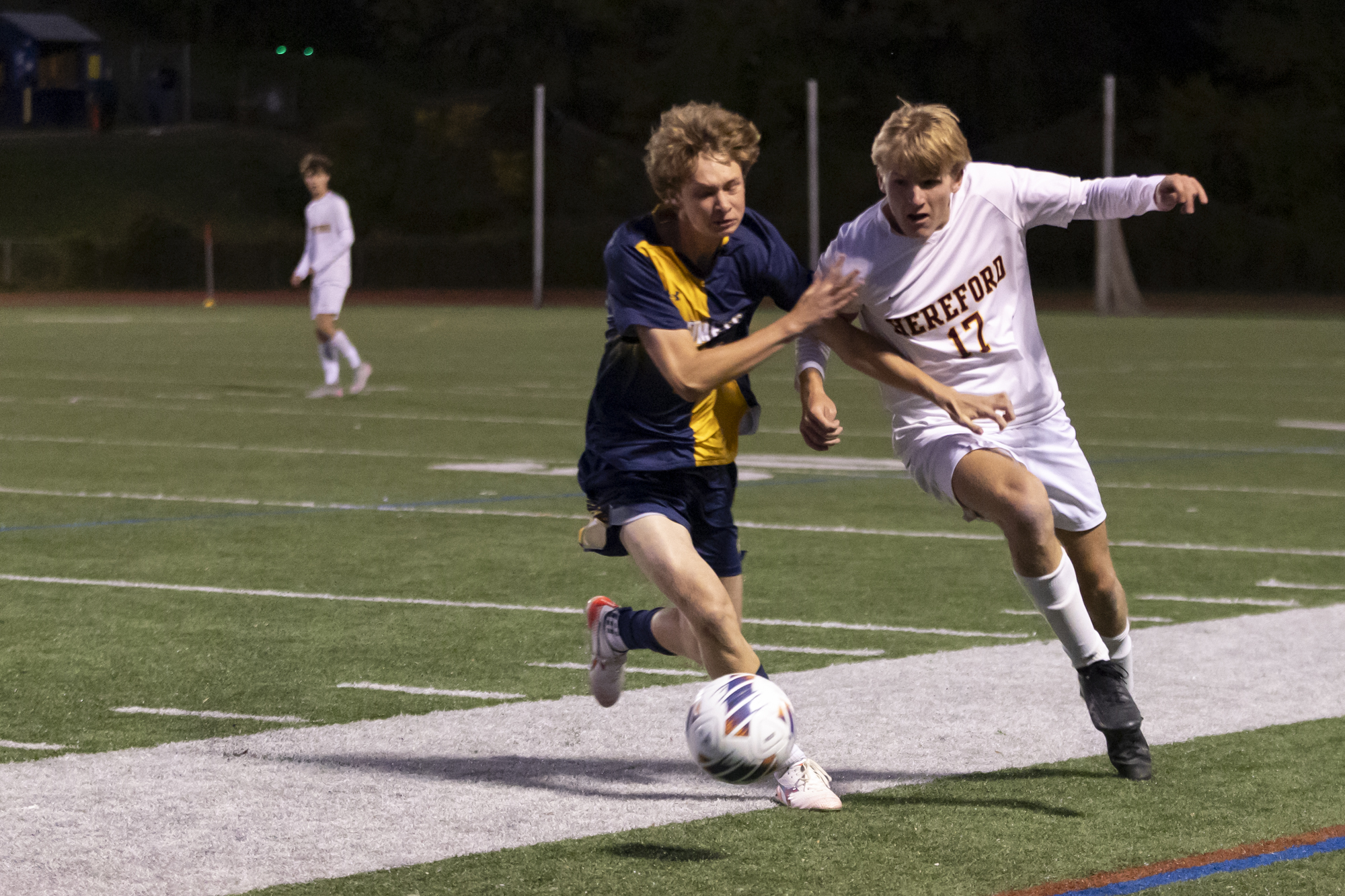 Dane Simonson, left, and Sam Nicholson compete for a free...