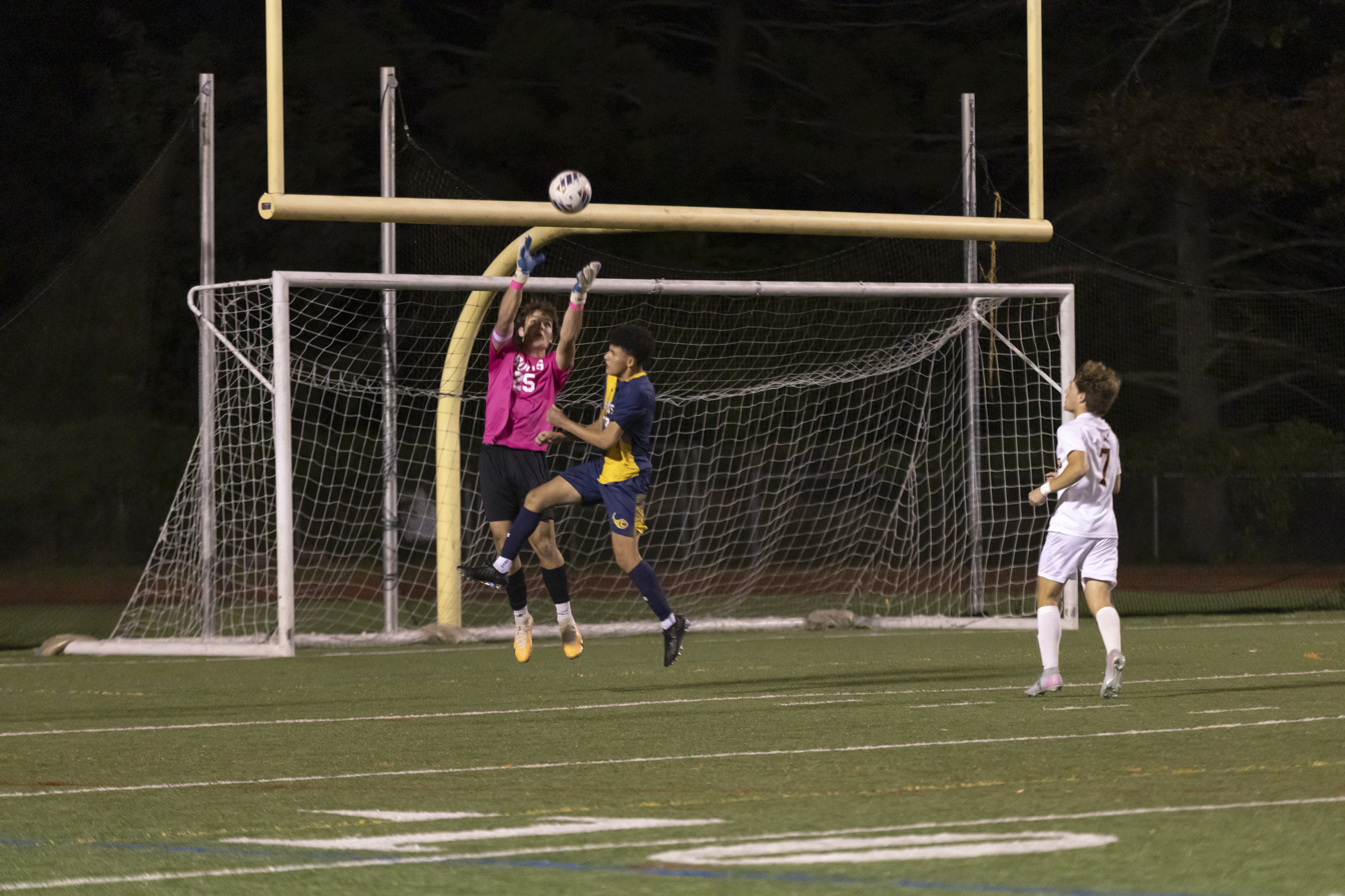 Hereford goalkeeper Reese Mays goes up against Anthony Argueta for...