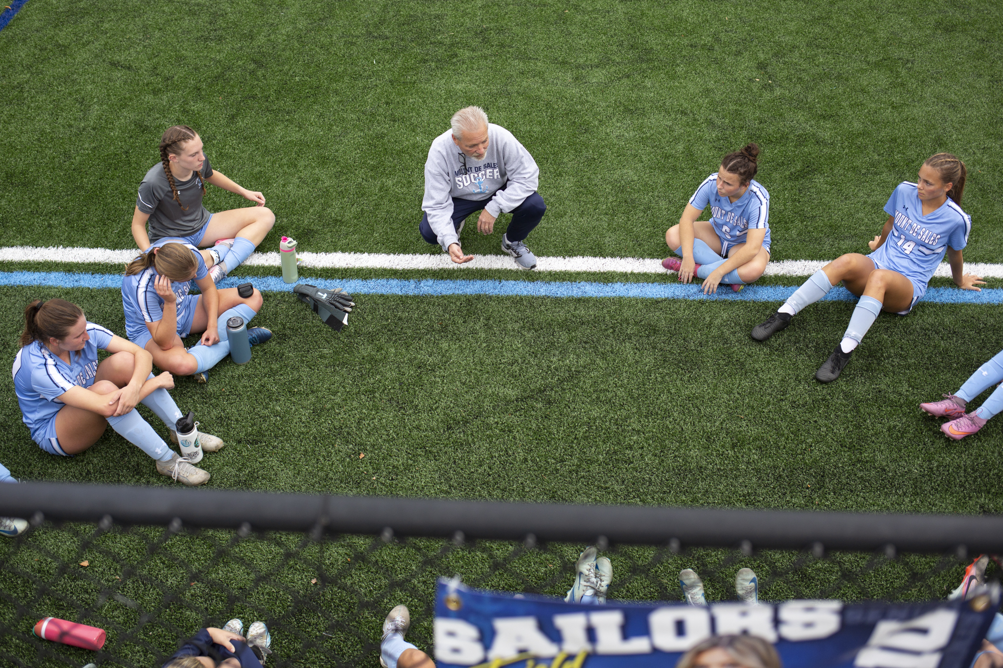 Mount de Sales head coach Dave Manser speaks to the...