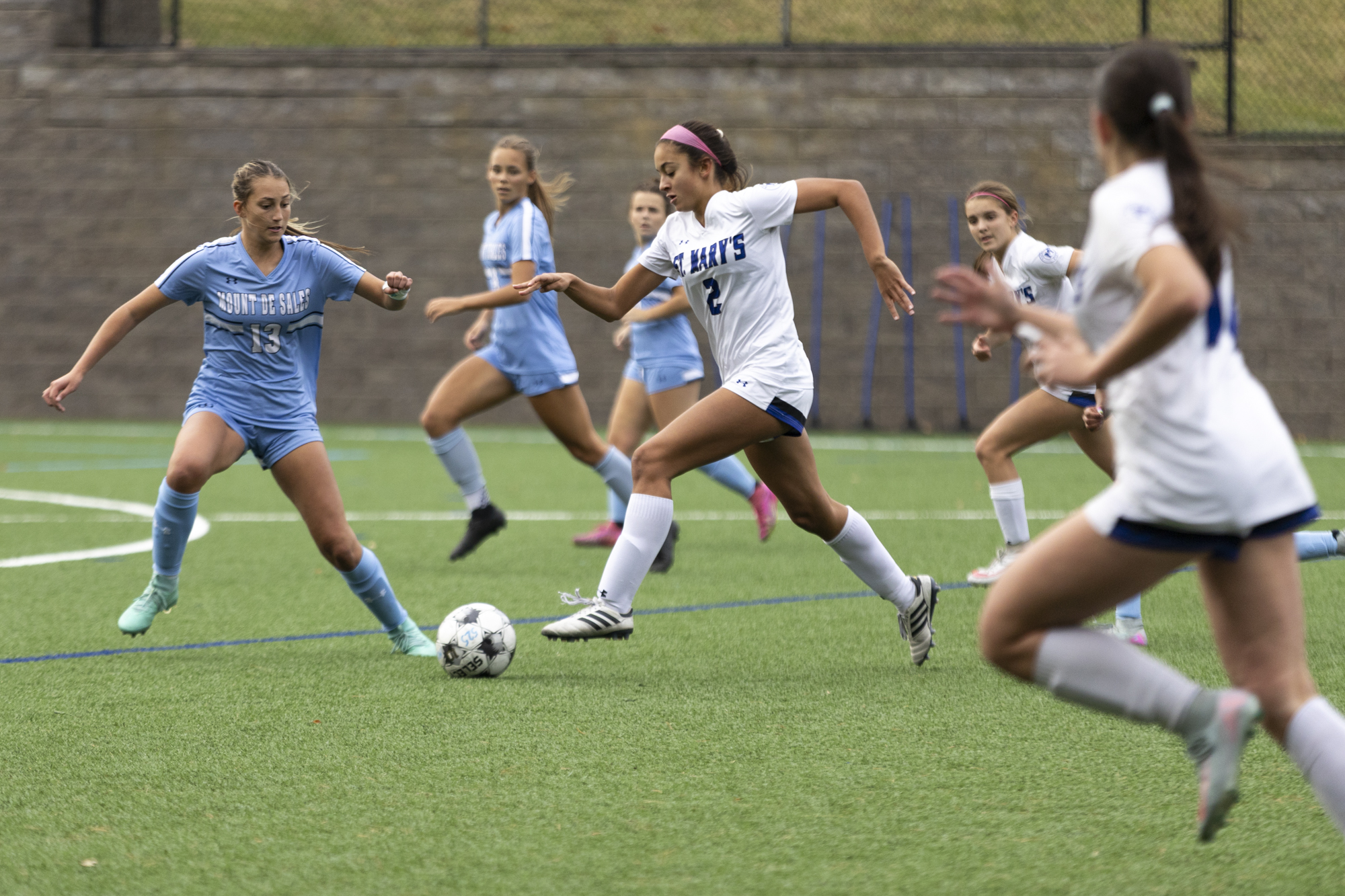 St. Mary’s Anna Hamilton charges into the Mount de Sales’...