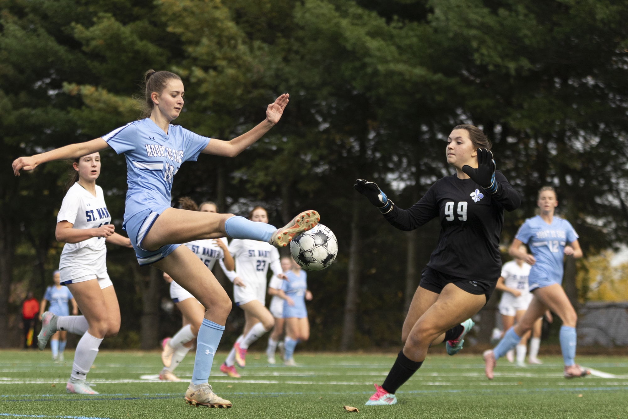 Kaitlyn Varisco attempts to sneak a shot past Saint Mary’s...