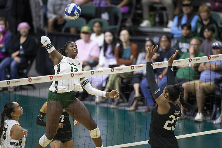 GEORGE F. LEE / GLEE@STARADVERTISER.COM
Hawaii Rainbow Wahine Miliana Sylvester hammered the ball against UC Santa Barbara Gauchos Jordyn Johnson during a Big West Womens volleyball game on Sunday, Oct. 12, at the Bankoh Arena, Stan Sheriff Center.