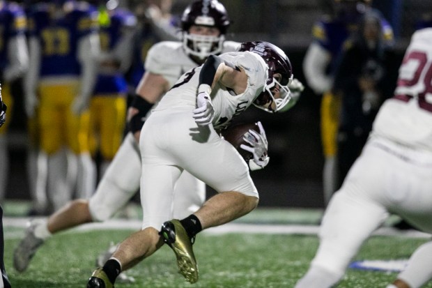Lockport's Colton Benaitis (3) stumbles after picking off a pass against Sandburg during a Class 8A first-round game in Orland Park on Saturday, Nov. 1, 2025. (Vincent D. Johnson / for the Daily Southtown)