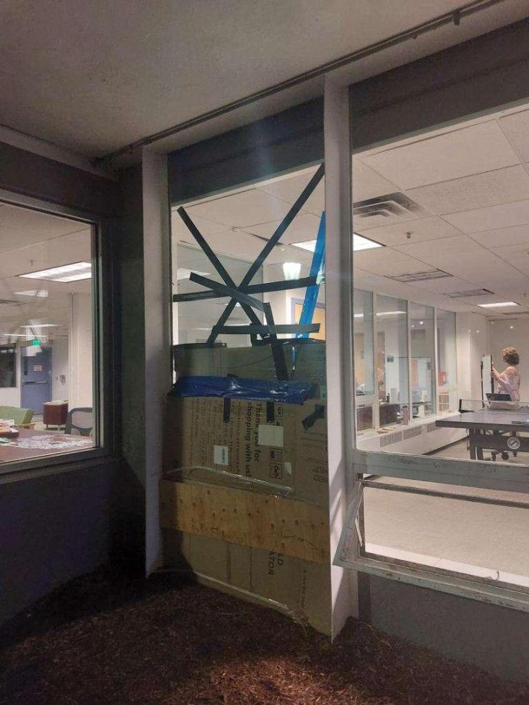 A broken window at Trinity Campus