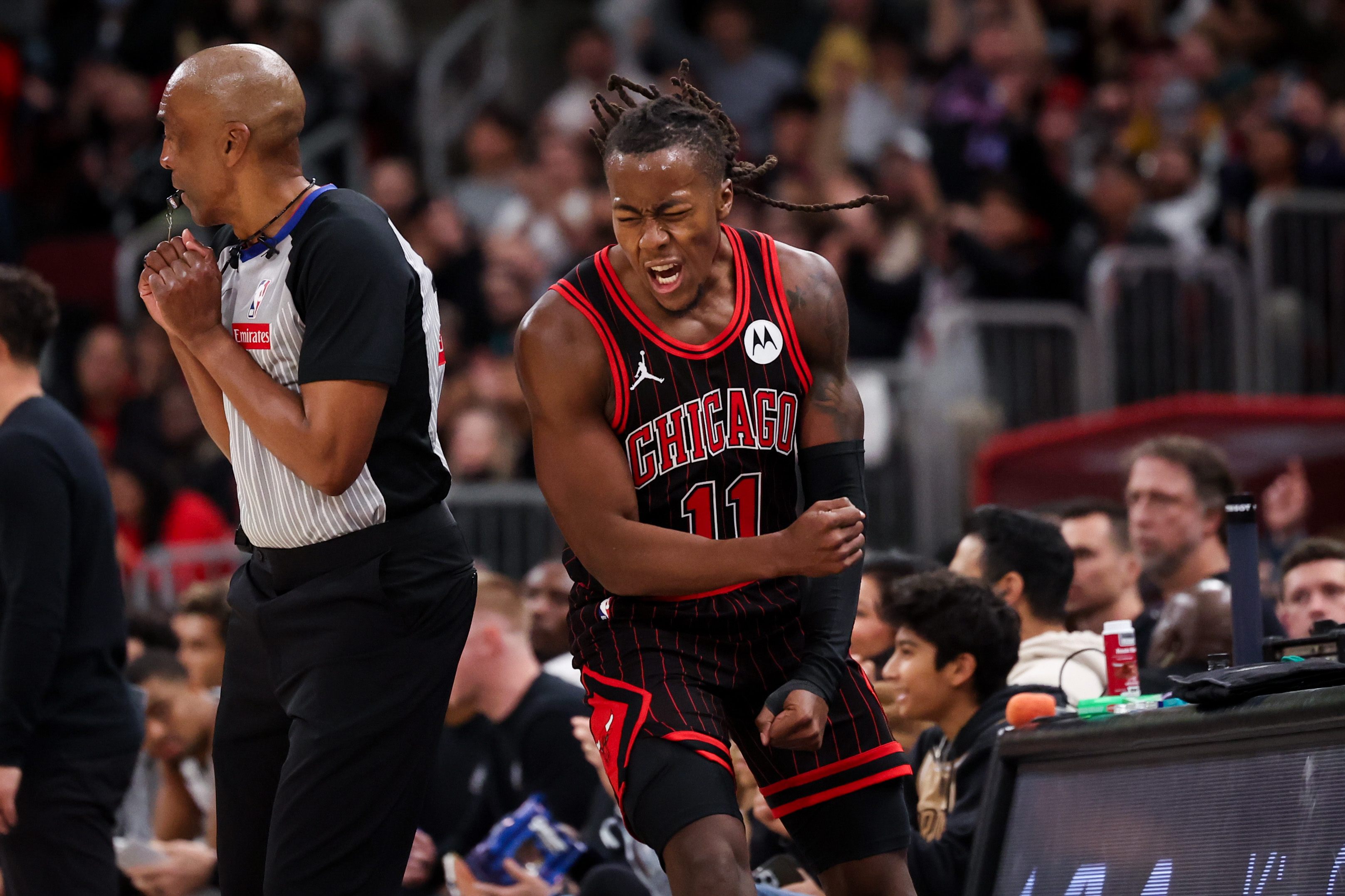 Chicago Bulls guard Ayo Dosunmu (11) celebrates after making a 3-point basket during the fourth quarter against the San Antonio Spurs at the United Center on Monday, Nov. 10, 2025, in Chicago. (Armando L. Sanchez/Chicago Tribune)