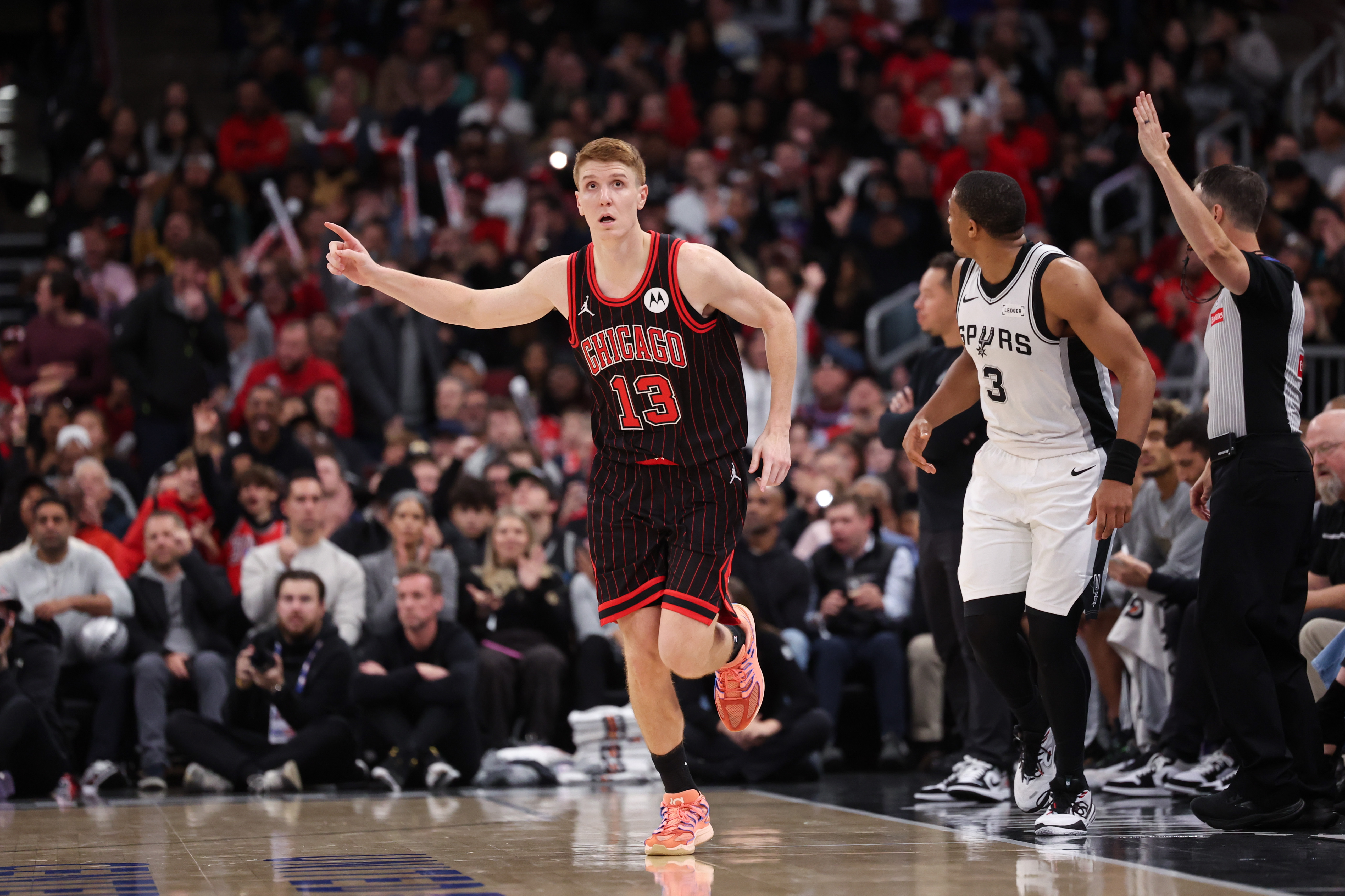 Chicago Bulls guard Kevin Huerter (13) points after making a 3-point shot during the fourth quarter against the San Antonio Spurs at the United Center on Monday, Nov. 10, 2025, in Chicago. (Armando L. Sanchez/Chicago Tribune)