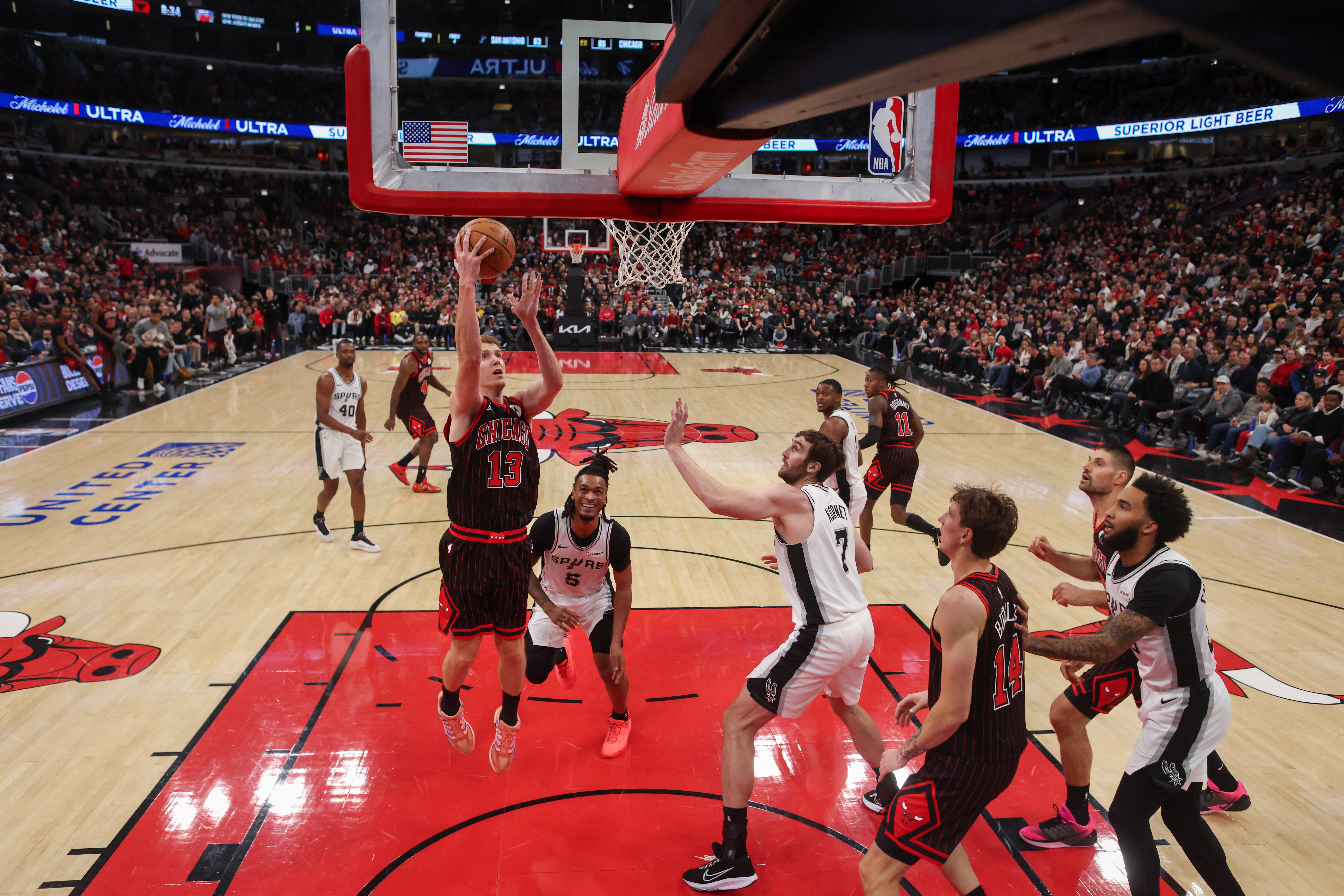 Chicago Bulls guard Kevin Huerter (13) goes up for a shot during the second half against the San Antonio Spurs at the United Center on Monday, Nov. 10, 2025, in Chicago. (Armando L. Sanchez/Chicago Tribune)