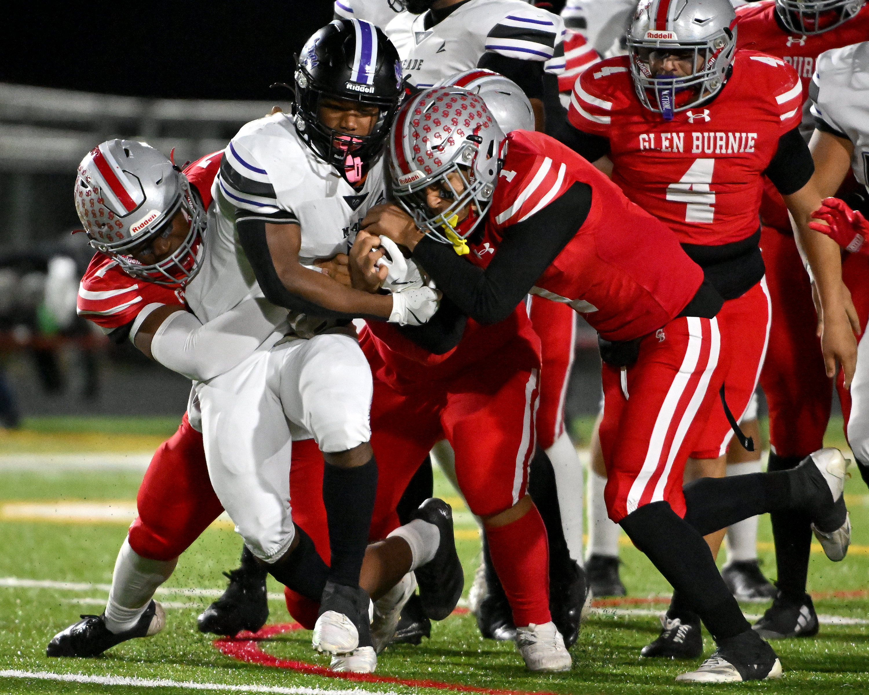 Nov. 14, 2025: Meade's Jayden Rumley is tackled by Glen Burnie's Daniel Buruca ​in the first quarter. The Glen Burnie Gophers defeat the visiting Meade Mustangs, 41-35, in a MPSSAA Class 4A East Region second round playoff football game. (Paul W. Gillespie/Staff)