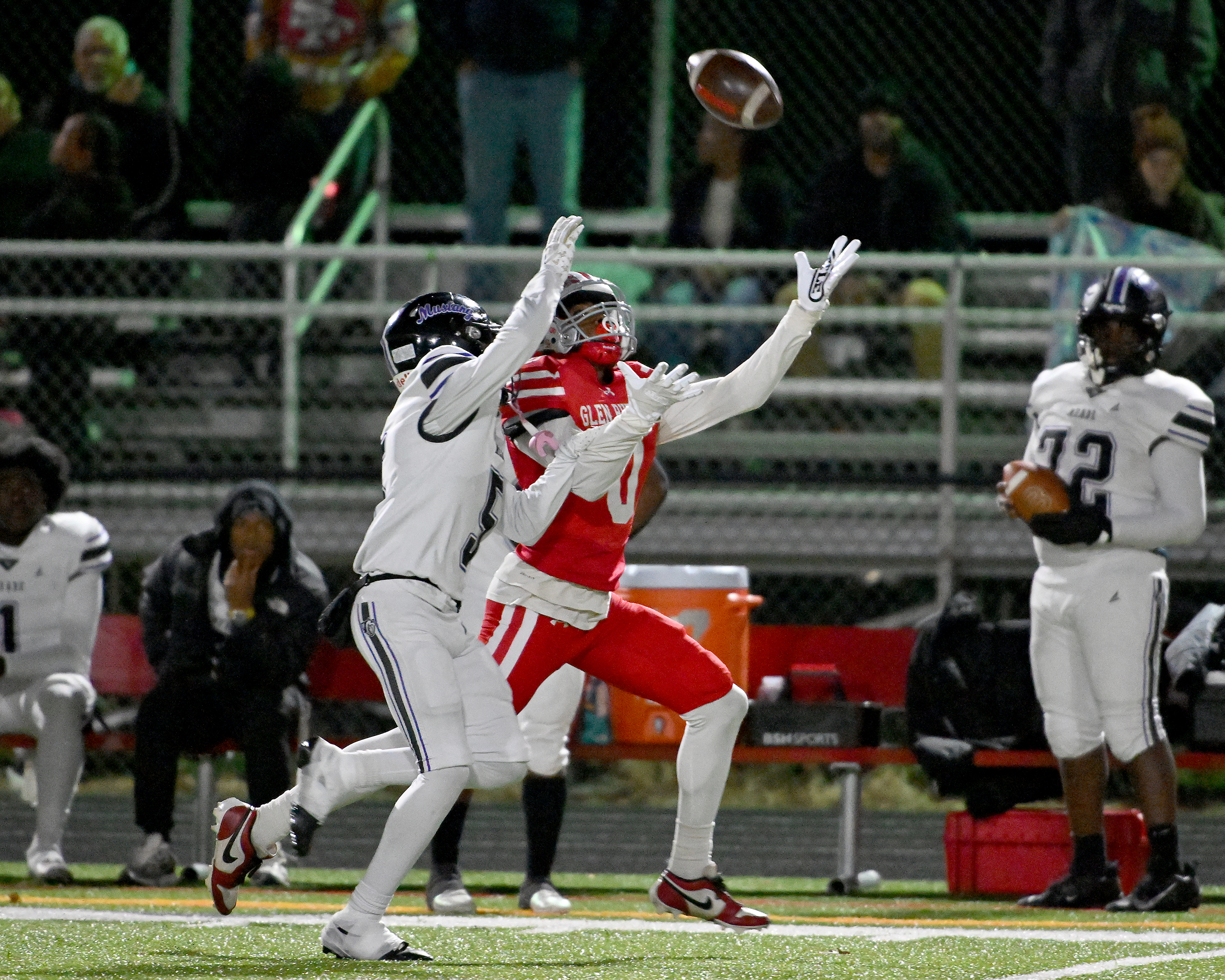 Nov. 14, 2025: Glen Burnie quarterback Robert Saunders' ​throw is just out of reach of receiver Glen Burnie's Chris Maddox ​as Meade's Myles Edwards covers him in the second quarter. The Glen Burnie Gophers defeat the visiting Meade Mustangs, 41-35, in a MPSSAA Class 4A East Region second round playoff football game. (Paul W. Gillespie/Staff)