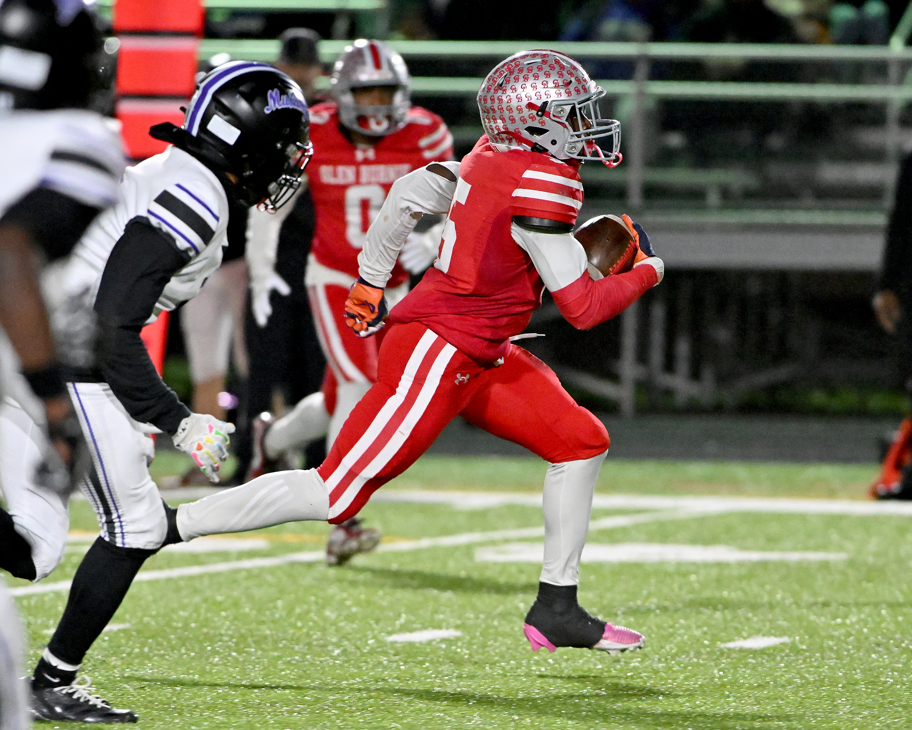 Nov. 14, 2025: Glen Burnie's Kendrick Taylor gains big yards after a catch and runs for a touchdown in the second quarter. The Glen Burnie Gophers defeat the visiting Meade Mustangs, 41-35, in a MPSSAA Class 4A East Region second round playoff football game. (Paul W. Gillespie/Staff)
