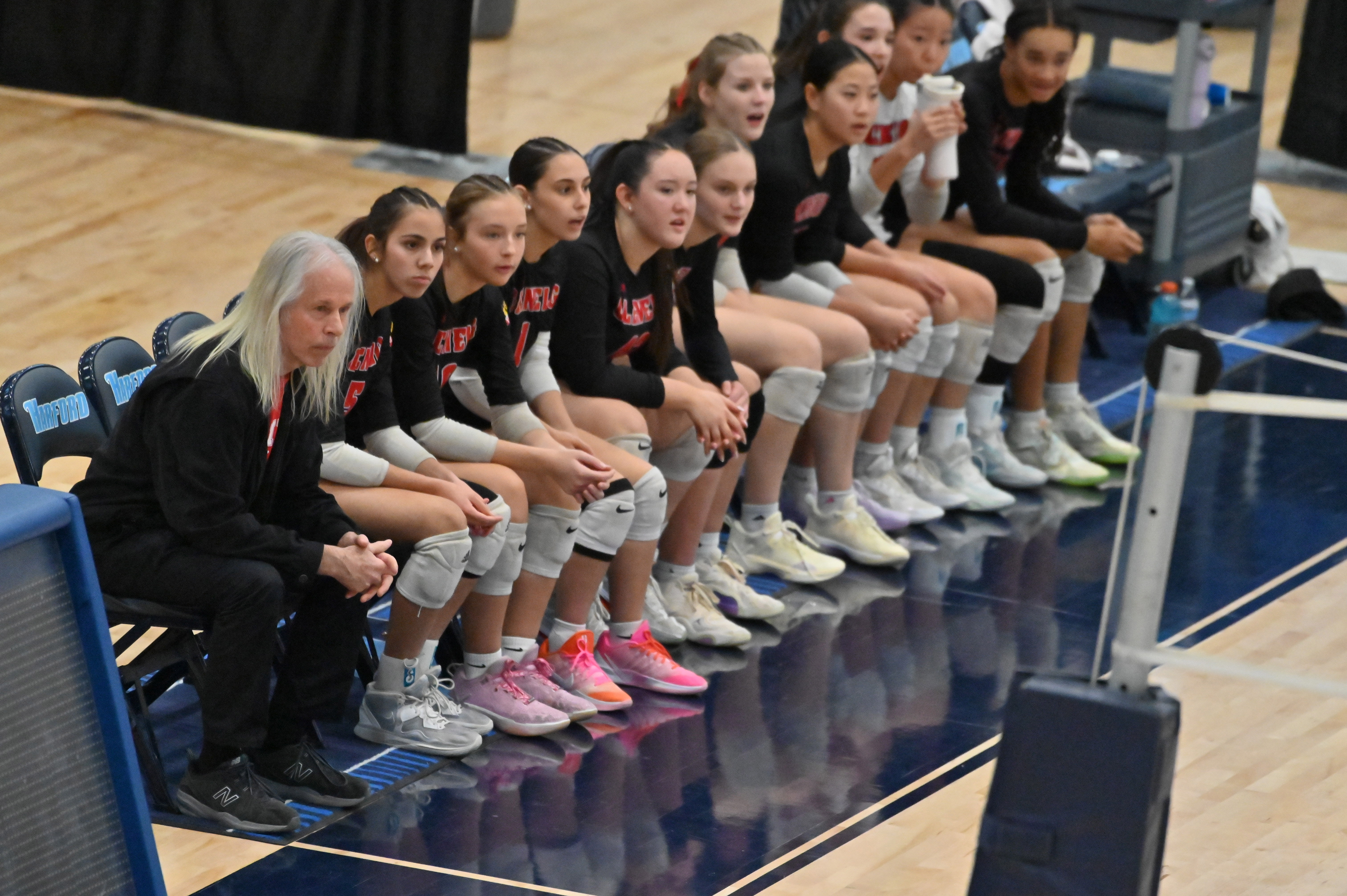 Glenelg coach Nick Sharp and teammates watch action play out in their match against Williamsport during the Class 2A volleyball state championship at Harford Community College on Saturday. (Brian Krista/Staff)