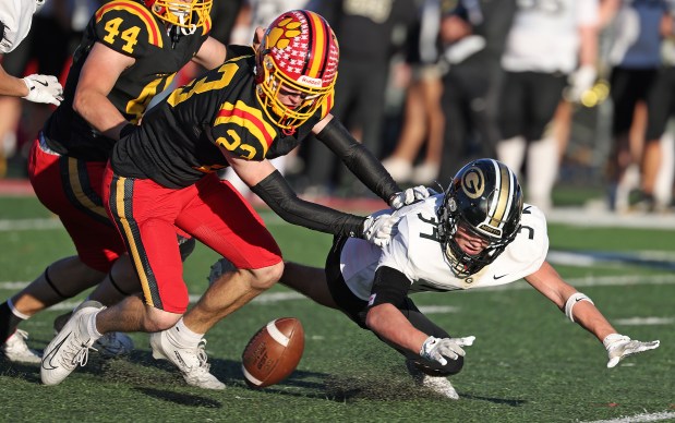 Batavia's Andrew Culotta (23) recovers a fumble by Glenbard North's Angelo Gatses (34) in the fourth quarter during a Class 7A state quarterfinal game in Batavia on Saturday, Nov. 15, 2025. H. Rick Bamman/for the Beacon-News