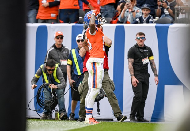 Pat Bryant (13) of the Denver Broncos celebrates catching a touchdown pass from Bo Nix (10) during the second quarter against the Dallas Cowboys at Empower Field at Mile High in Denver on Sunday, Oct. 26, 2025. (Photo by AAron Ontiveroz/The Denver Post)