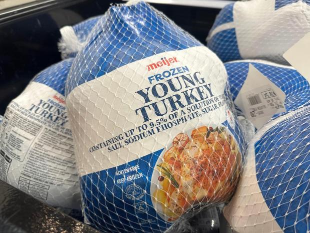 Frozen turkeys are on display at a Meijer store Friday, Nov. 21, 2025, in Canton Township, Mich