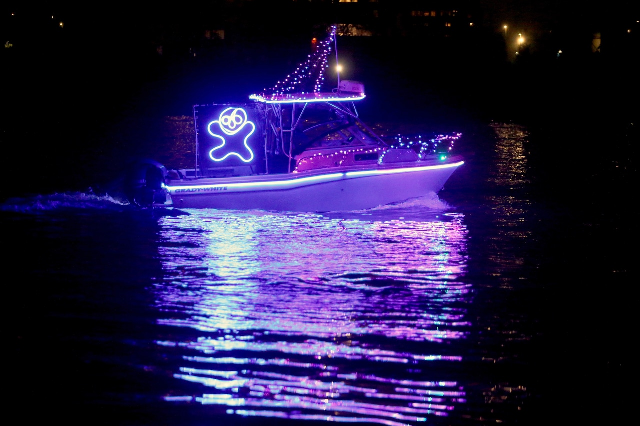 Christmas ships are seen leaving Riverplace Marina in downtown Portland on Tuesday, Dec. 7, 2021.
