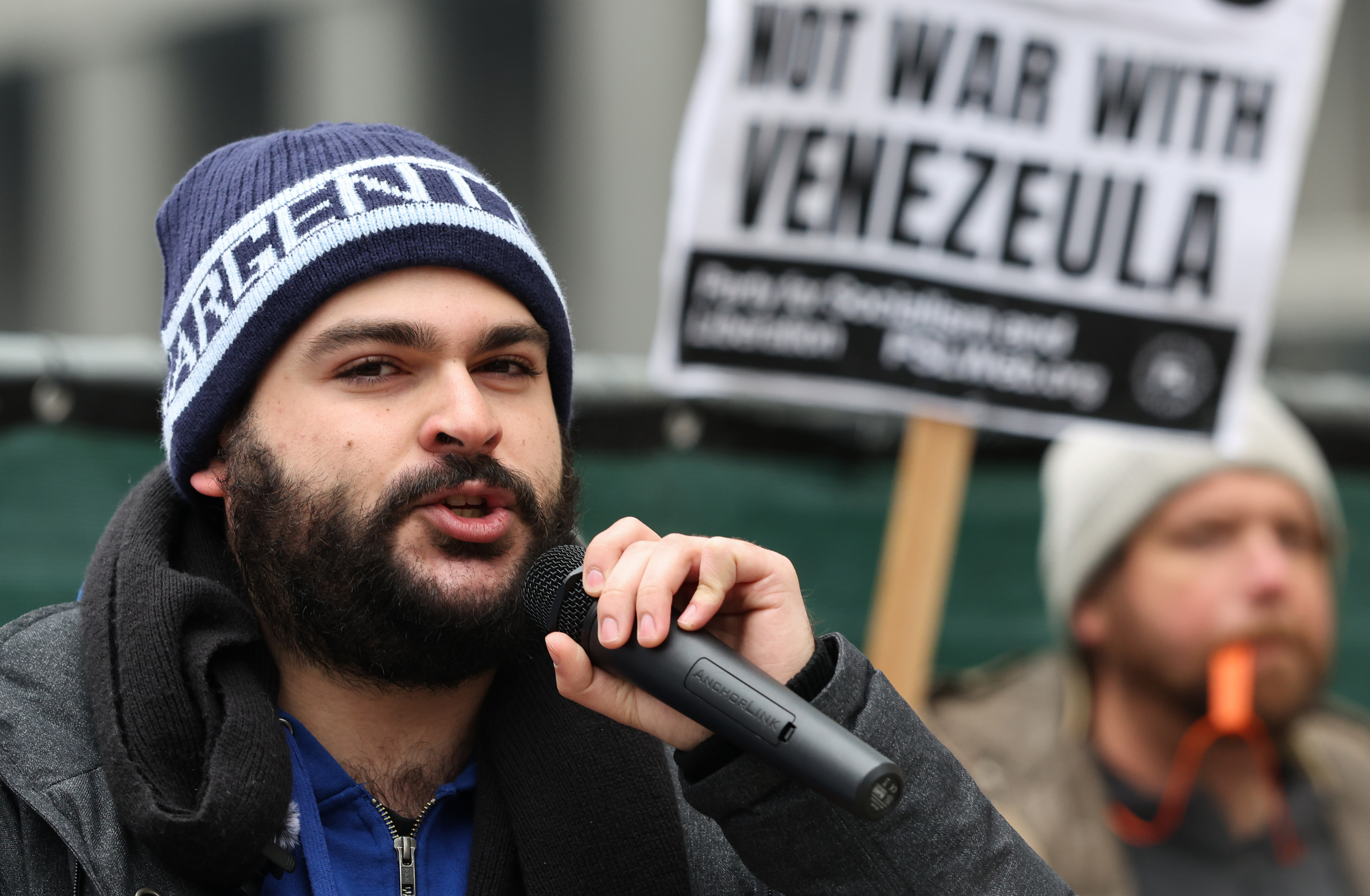 Eli Navarro speaks during a demonstration decrying recent U.S. military...
