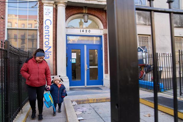 Families leave CentroNia at the end of the school day in Washington, Tuesday, Dec. 9, 2025. (AP Photo/Jacquelyn Martin)