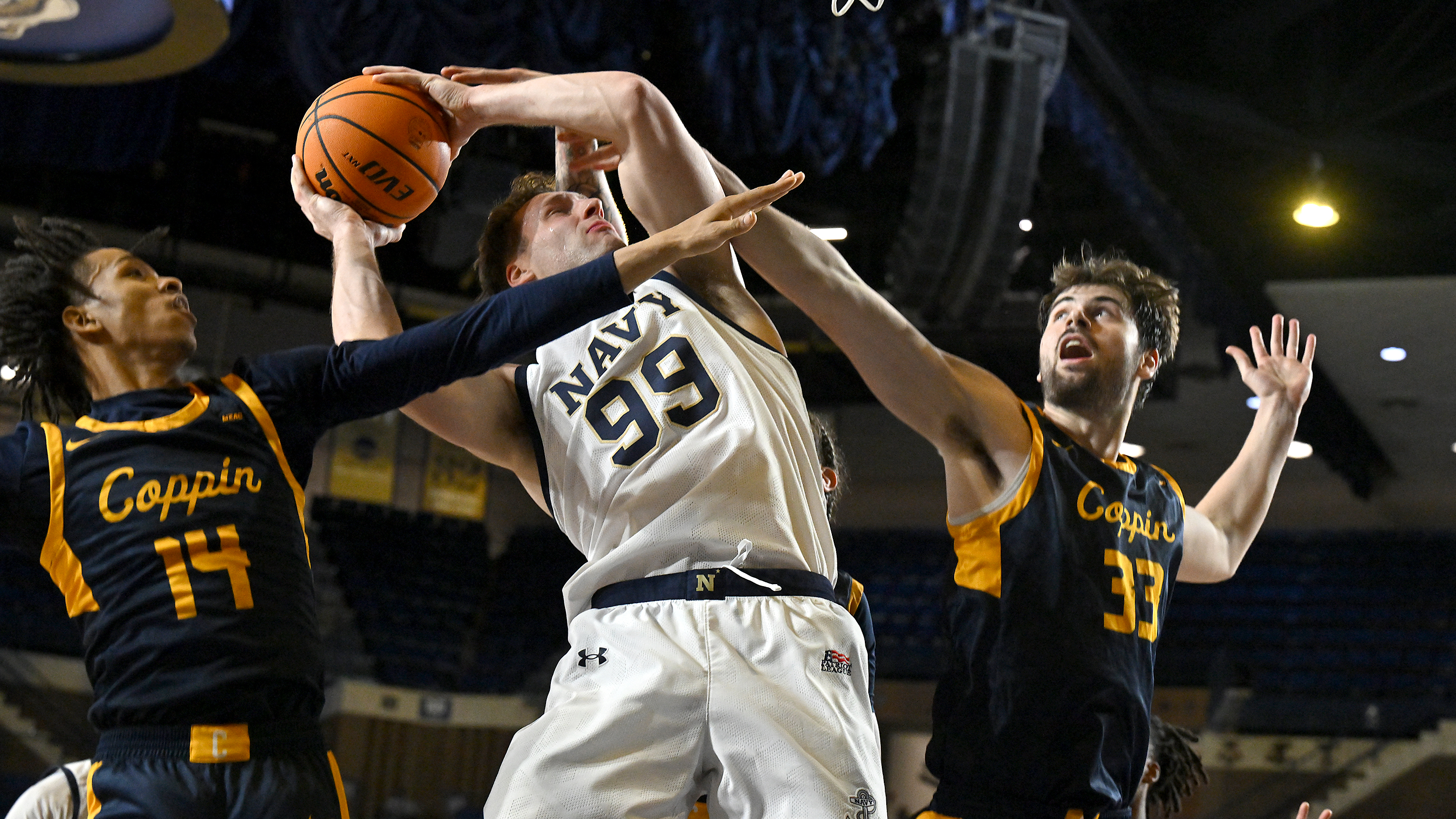 Dec. 19, 2025 Navyâs Aidan Kehoe muscles in a shot...