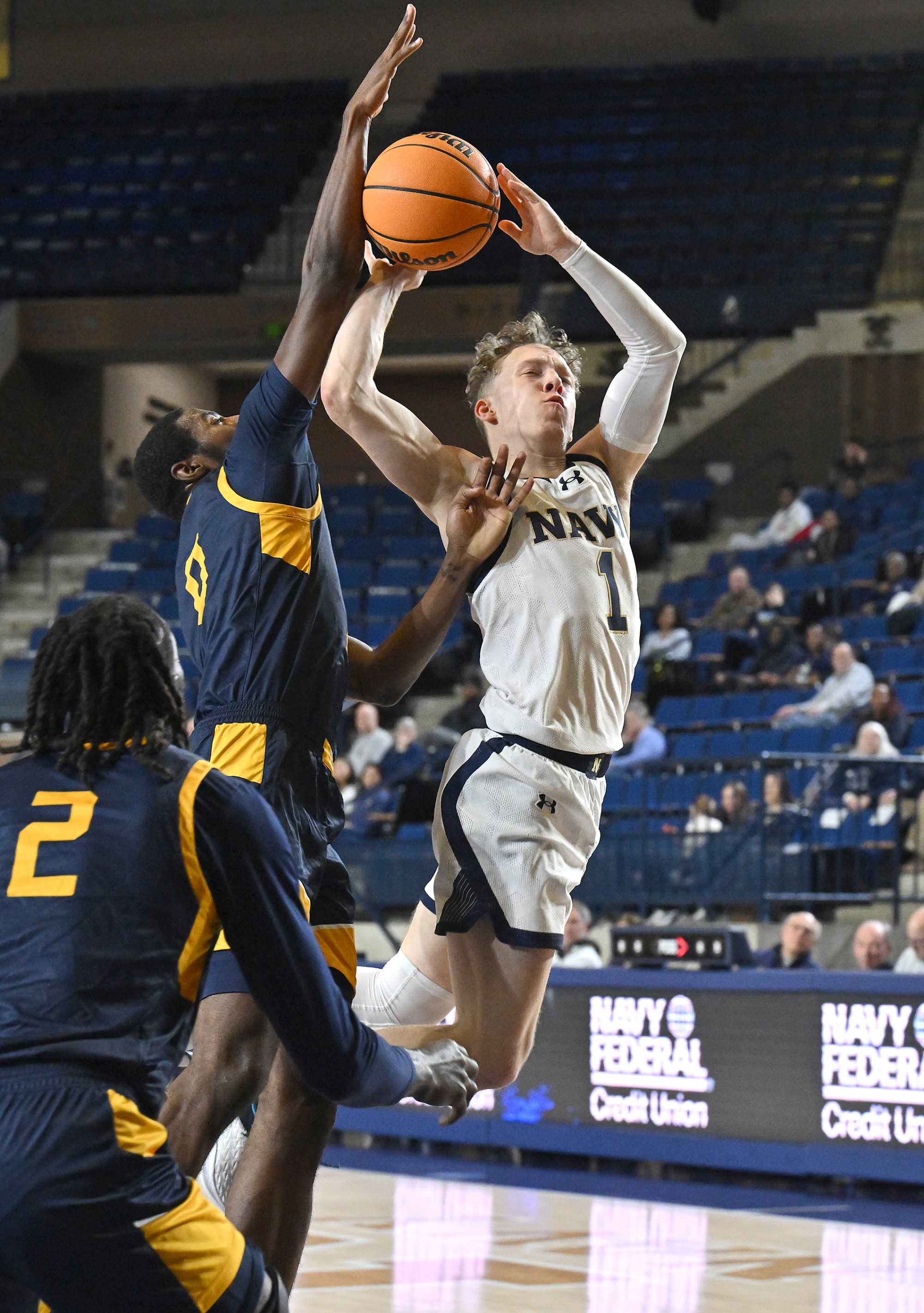 Dec. 19, 2025 Navyâs Austin Benigni is fouled by Coppin...