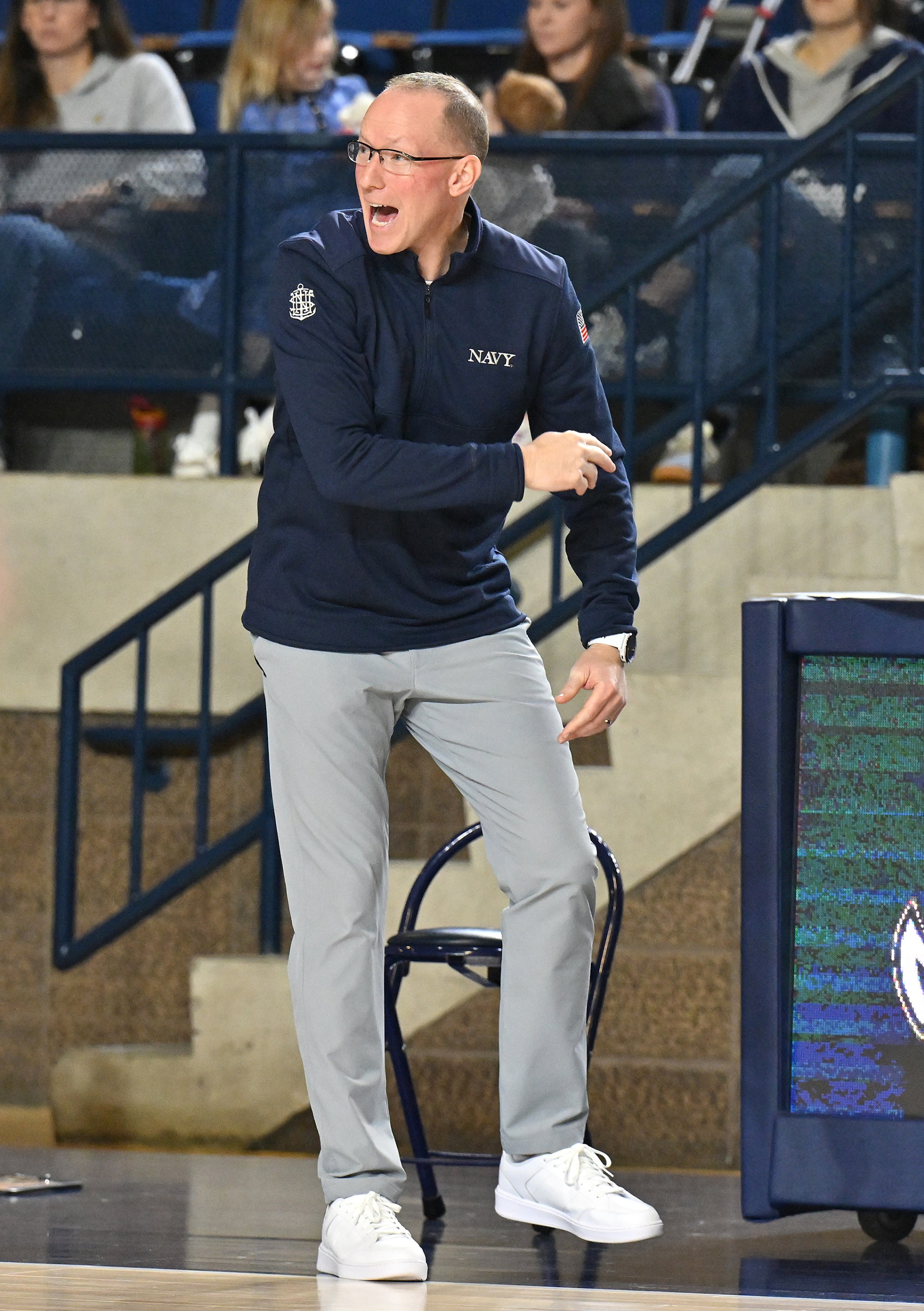 Dec. 19, 2025 Navy coach Joe Perry in the second...