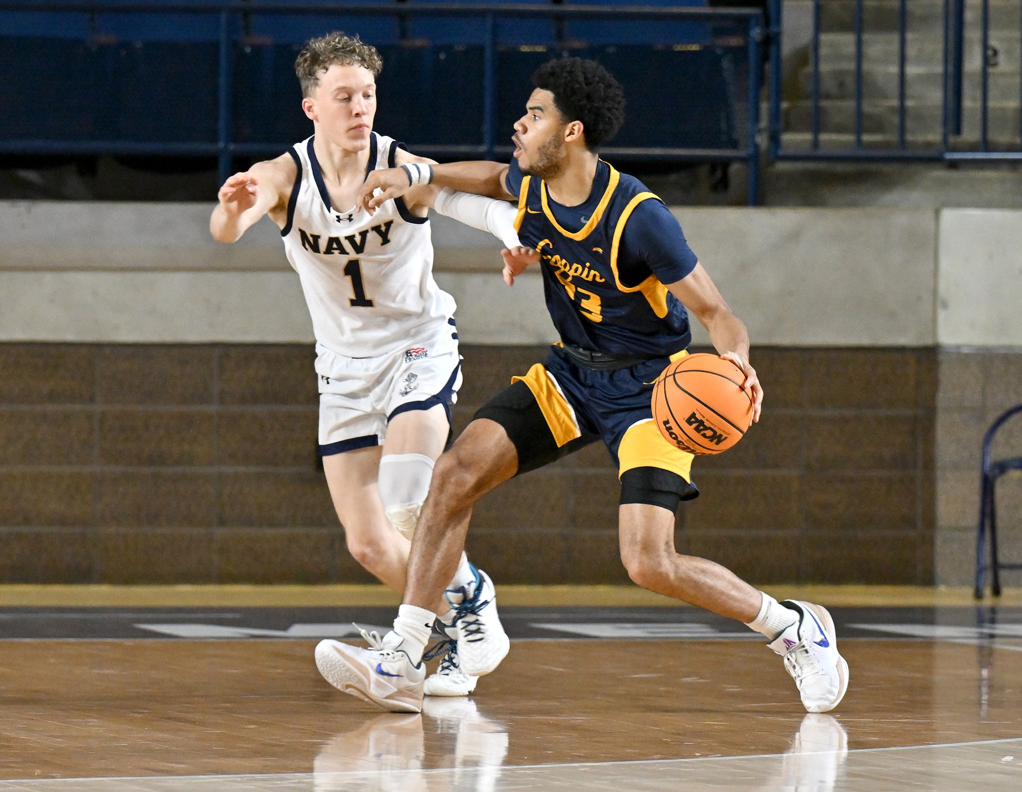 Dec. 19, 2025 Navyâs Austin Benigni guards against Coppin State’s...