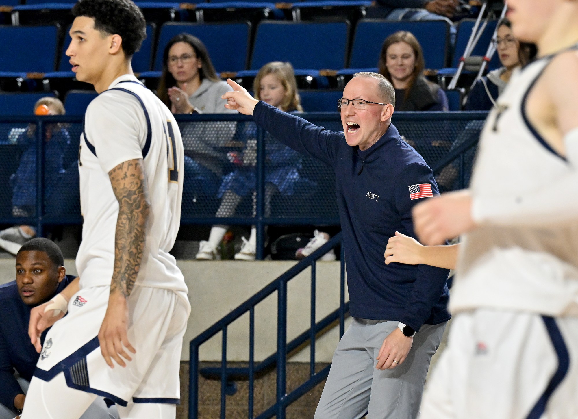 Dec. 19, 2025 Navy coach Joe Perry in the second...