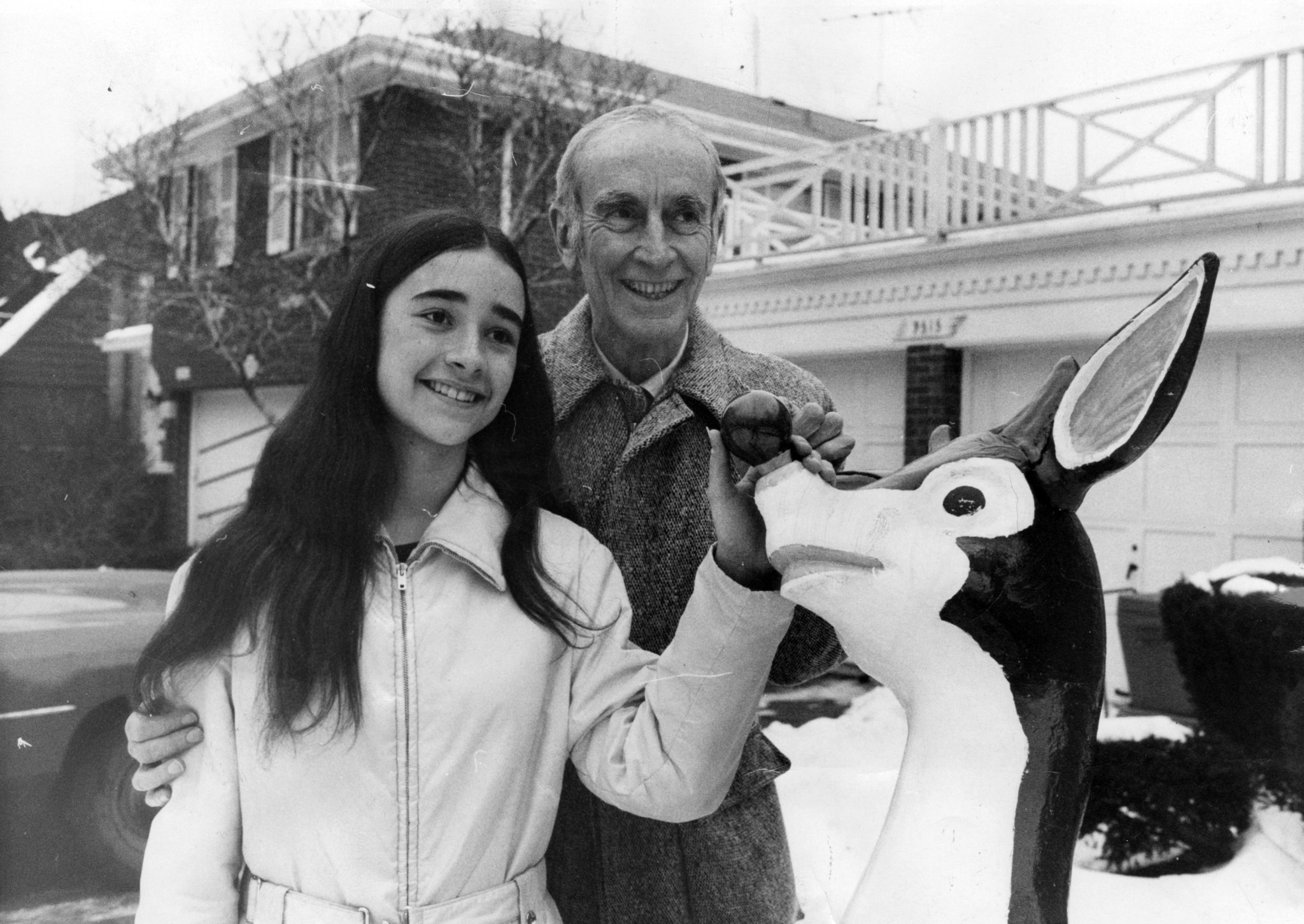 Robert L. May, 67, the creator of Rudolph the Red Nosed Reindeer, stands outside his home with his daughter Betsy, 14, and one of his Rudolphs on Dec. 20, 1972.
