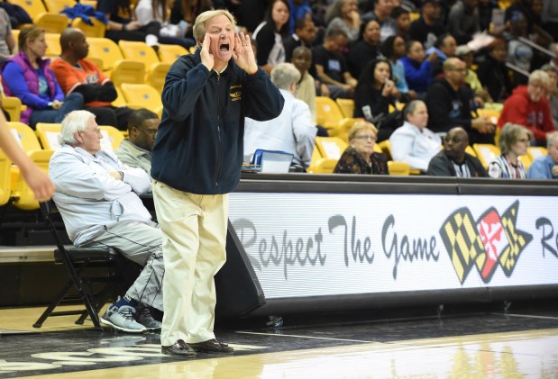 Catonsville head coach Mike Mohler shouts instructions to his players during the 4A girls basketball state championship game won by the Comets in 2018.