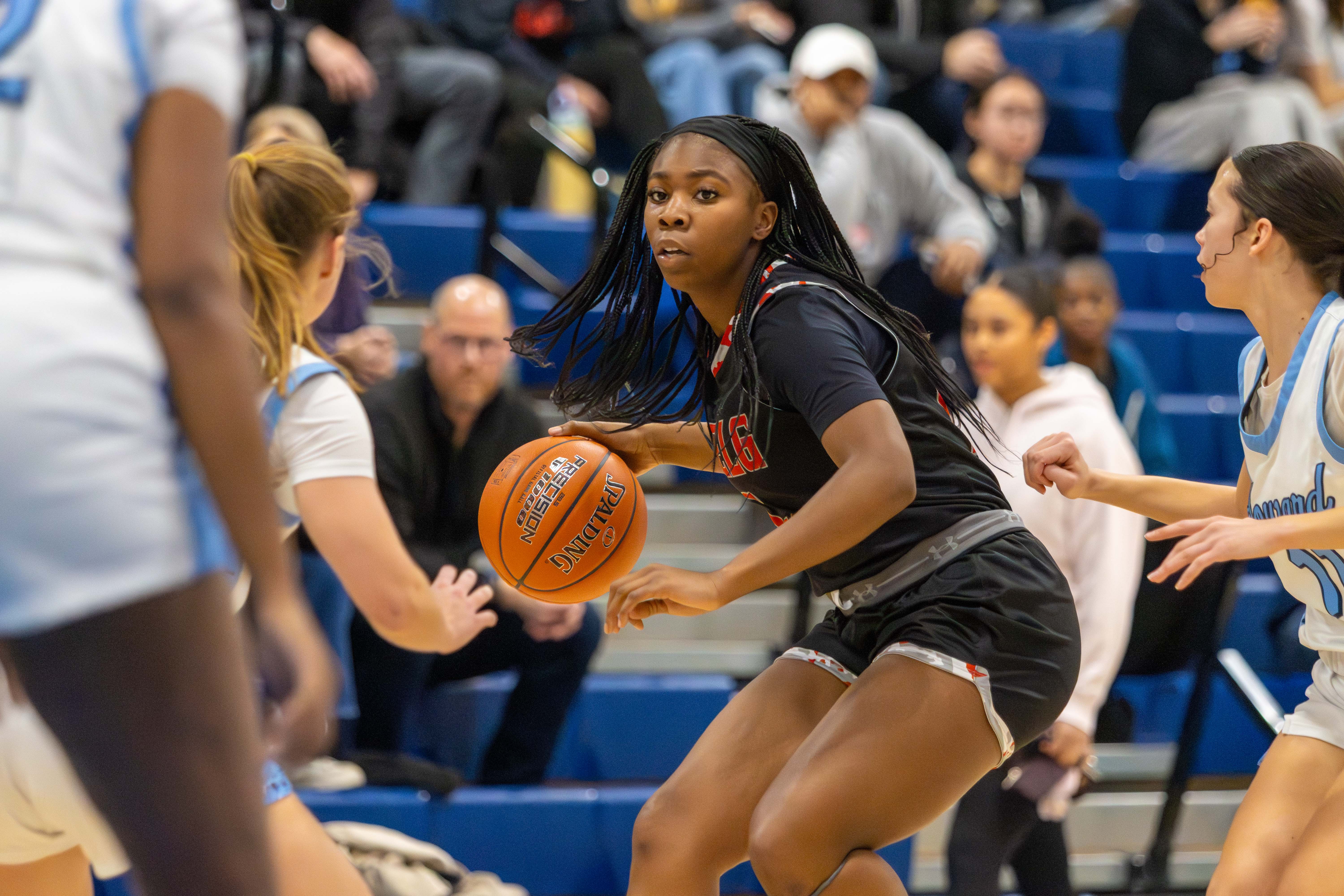 MJ Dabiri, Glenelg, handles ball surrounded by defenders during the...