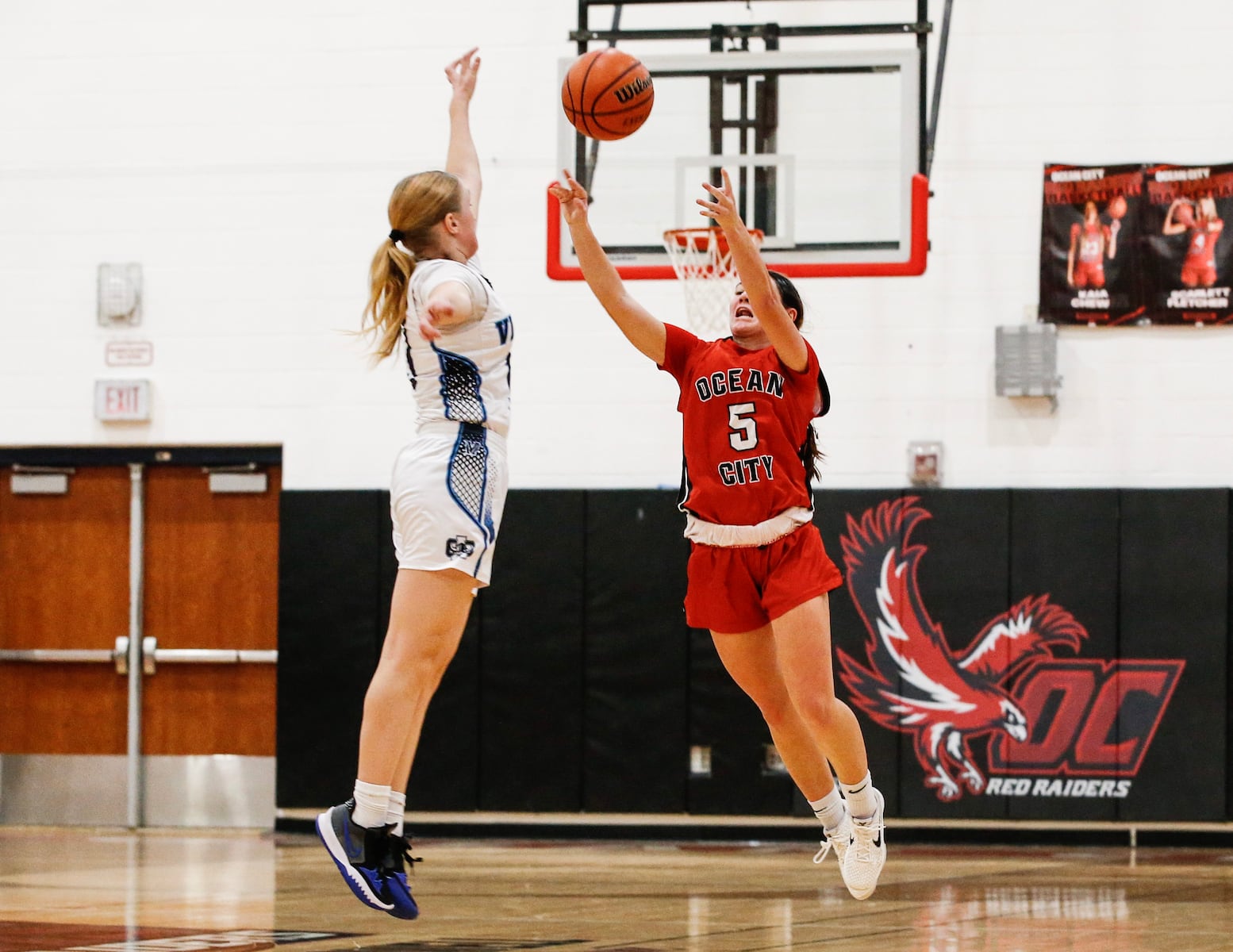 Gabby Henry (5) of Ocean City tries to tie the game at the buzzer against Juliana Margliano (13) of Atlantic City during the girls basketball game between Ocean City and Atlantic City at Ocean City High School in Ocean City, NJ on 1/14/26.