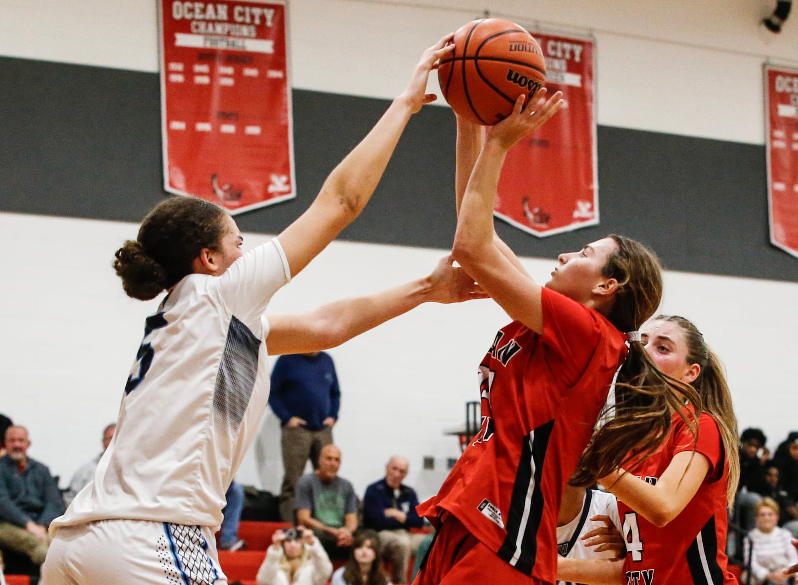 Laila Muniir (5) of Atlantic City blocks the shot from Marley Ostrander (14) of Ocean City during the girls basketball game between Ocean City and Atlantic City at Ocean City High School in Ocean City, NJ on 1/14/26.