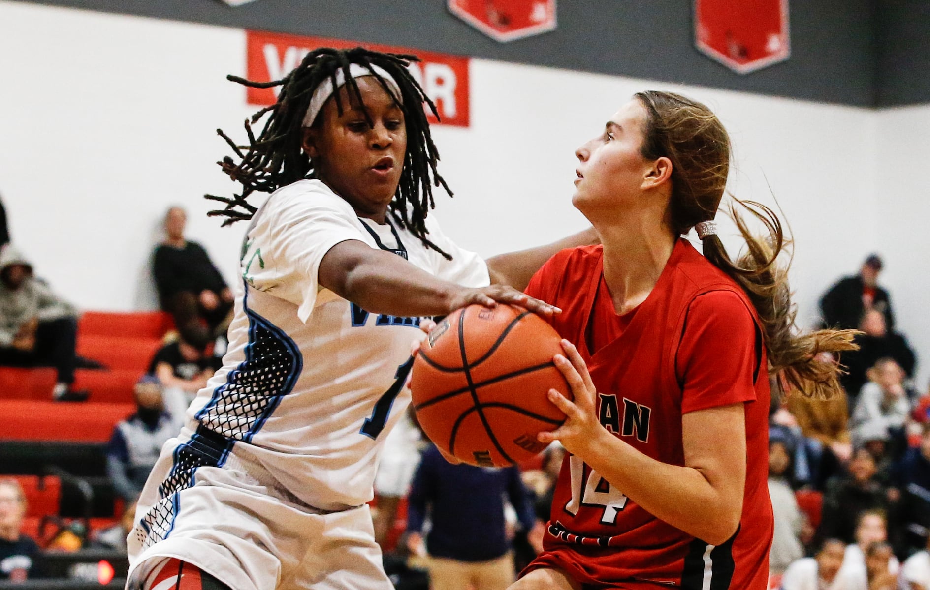 Sage Demby (1) of Atlantic City blocks the ball from Marley Ostrander (14) of Ocean City in the final seconds during the girls basketball game between Ocean City and Atlantic City at Ocean City High School in Ocean City, NJ on 1/14/26.