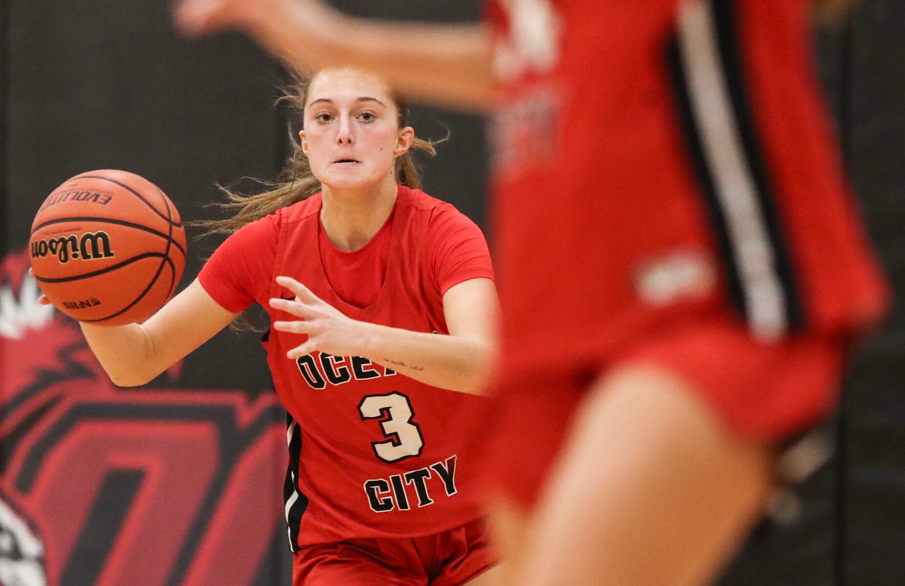 Allie Hudson (3) of Ocean City sends a pass up the floor during the girls basketball game between Ocean City and Atlantic City at Ocean City High School in Ocean City, NJ on 1/14/26.