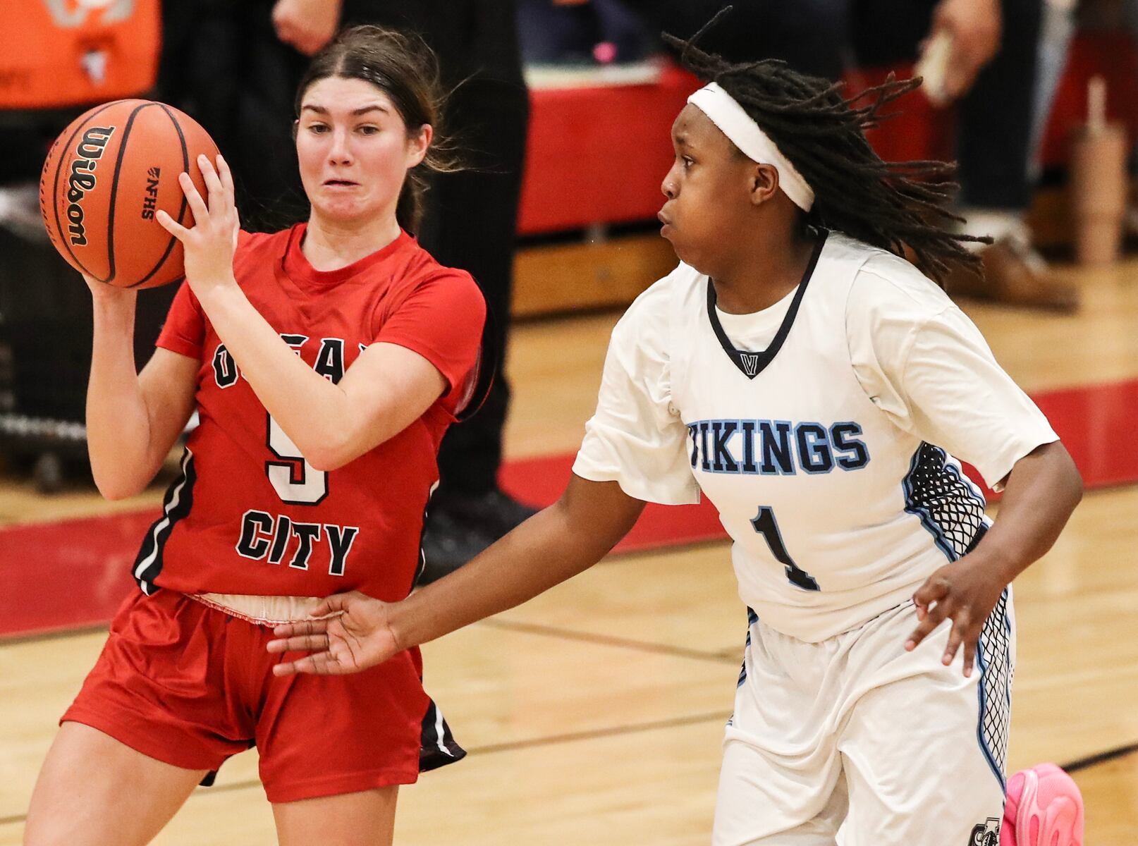 Gabby Henry (5) of Ocean City moves the ball as Sage Demby (1) of Atlantic City goes for a steal during the girls basketball game between Ocean City and Atlantic City at Ocean City High School in Ocean City, NJ on 1/14/26.