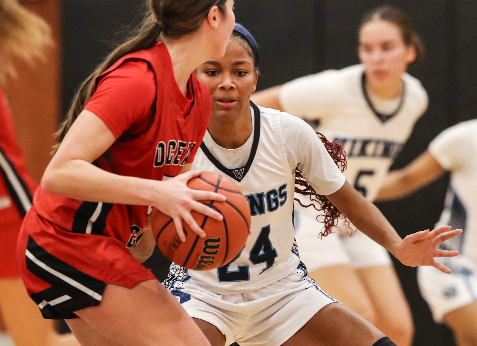 Taison Parker (24) of Atlantic City defends against Gabby Henry (5) of Ocean City during the girls basketball game between Ocean City and Atlantic City at Ocean City High School in Ocean City, NJ on 1/14/26.