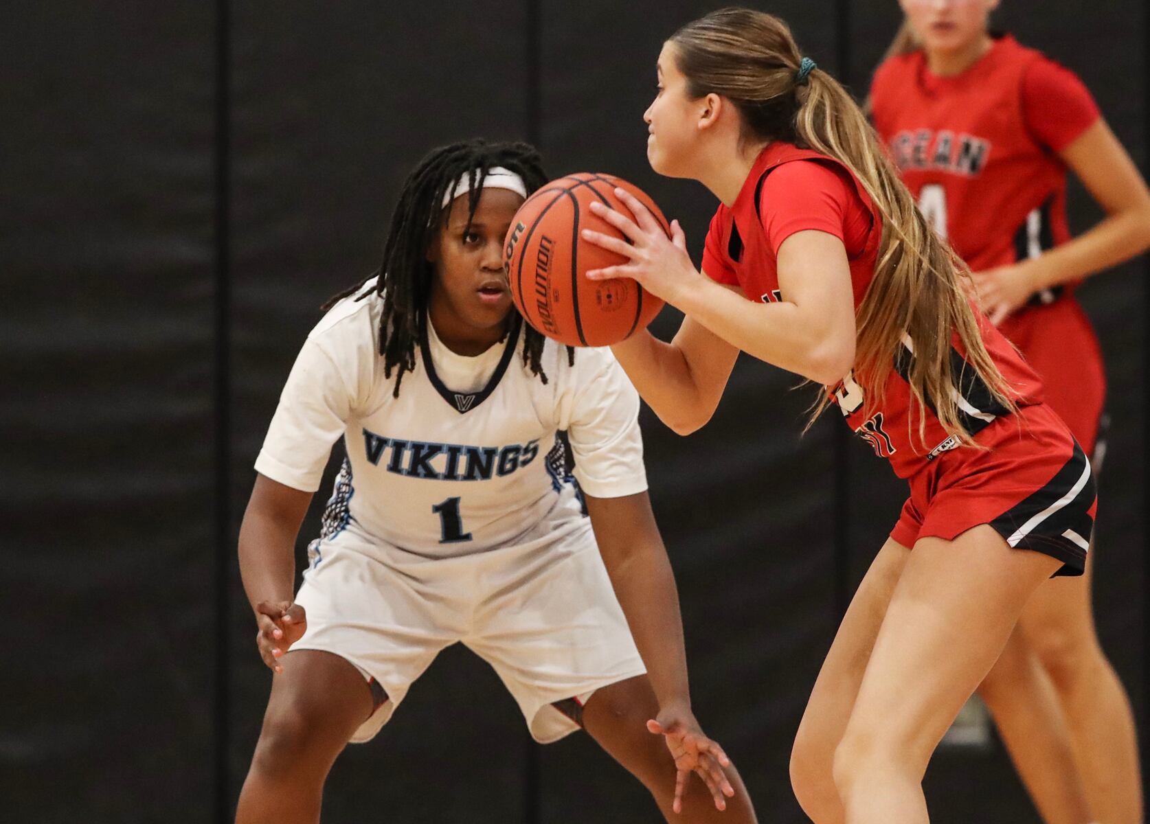 Sage Demby (1) of Atlantic City defends against Kaia Chew (23) of Ocean City during the girls basketball game between Ocean City and Atlantic City at Ocean City High School in Ocean City, NJ on 1/14/26.