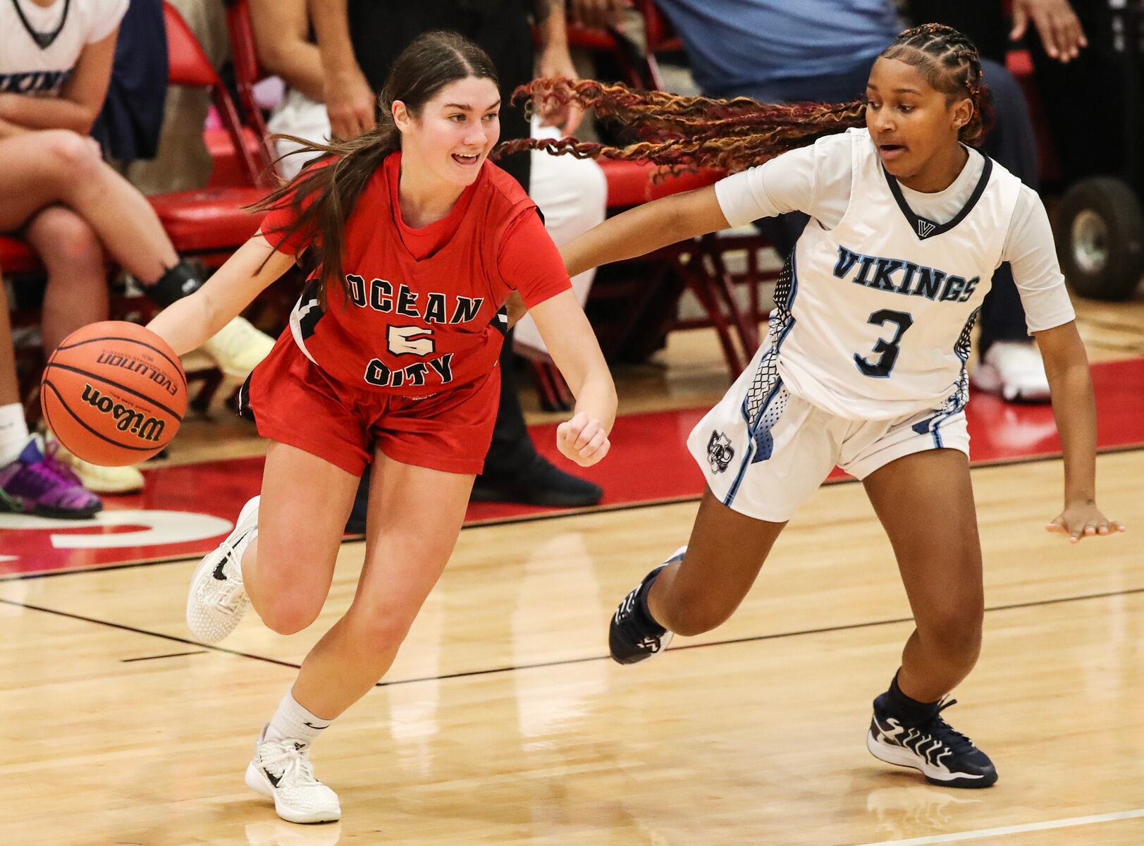Gabby Henry (5) of Ocean City tries to drive past Solay Parker (3) of Atlantic City during the girls basketball game between Ocean City and Atlantic City at Ocean City High School in Ocean City, NJ on 1/14/26.