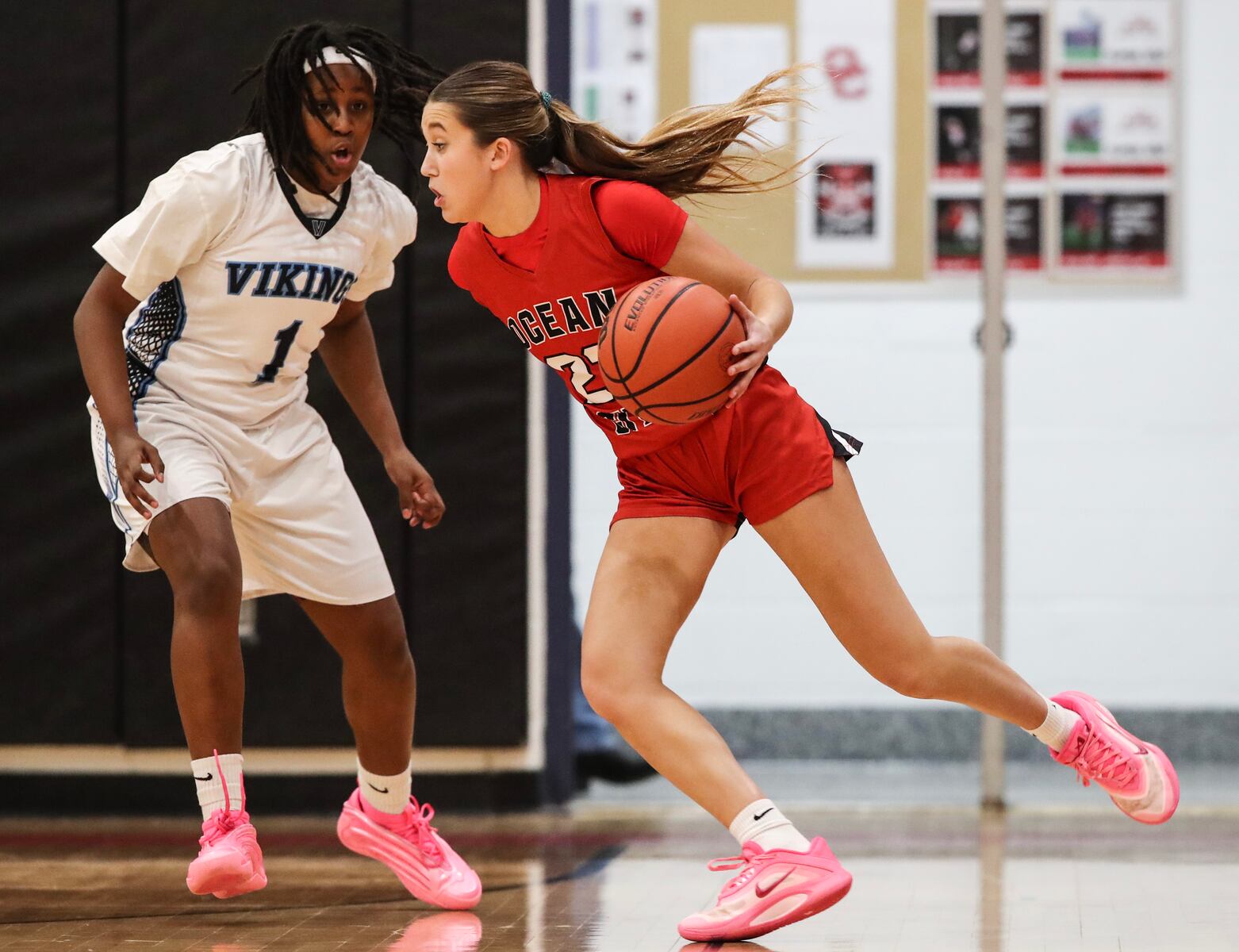 Kaia Chew (23) of Ocean City tries to dribble past Sage Demby (1) of Atlantic City during the girls basketball game between Ocean City and Atlantic City at Ocean City High School in Ocean City, NJ on 1/14/26.