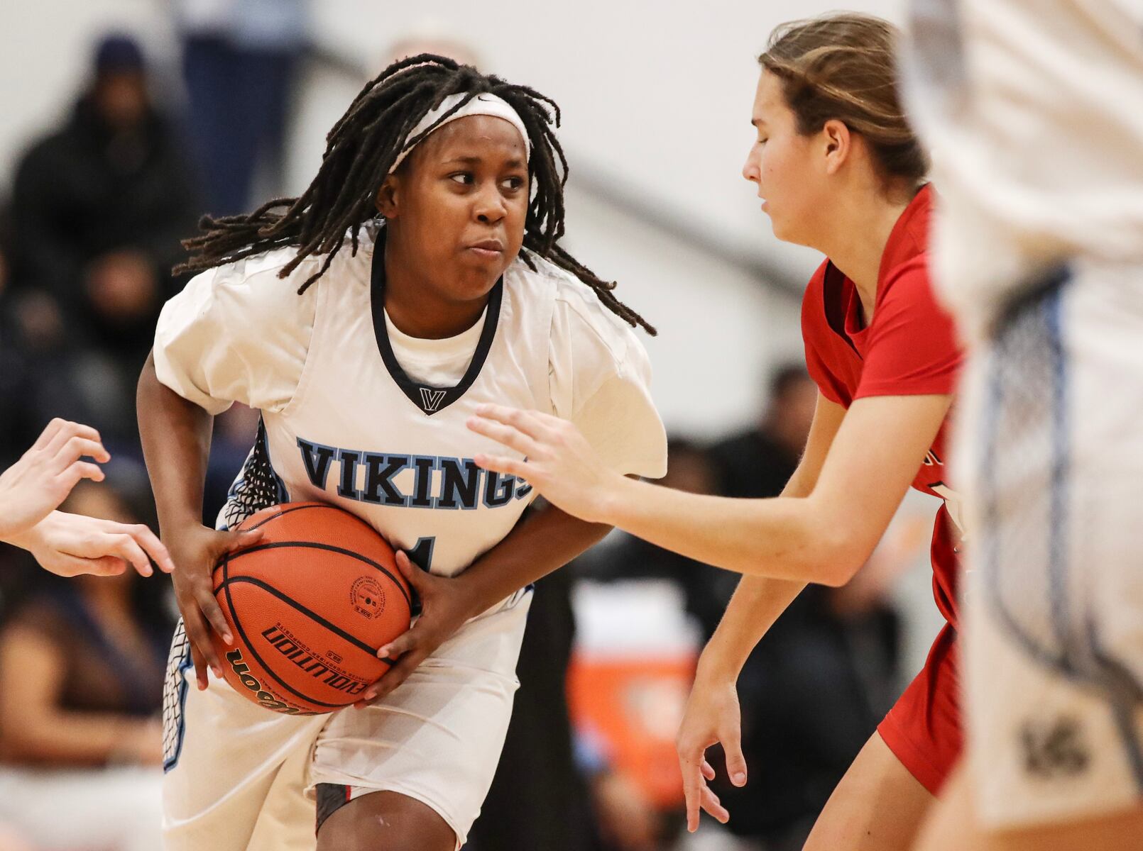 Sage Demby (1) of Atlantic City tries to move past Marley Ostrander (14) of Ocean City during the girls basketball game between Ocean City and Atlantic City at Ocean City High School in Ocean City, NJ on 1/14/26.