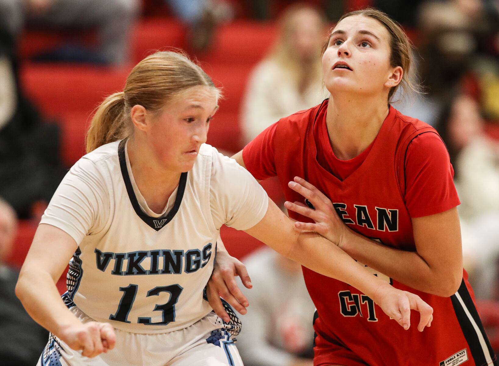 Juliana Margliano (13) of Atlantic City and Marley Ostrander (14) of Ocean City battle for position during the girls basketball game between Ocean City and Atlantic City at Ocean City High School in Ocean City, NJ on 1/14/26.