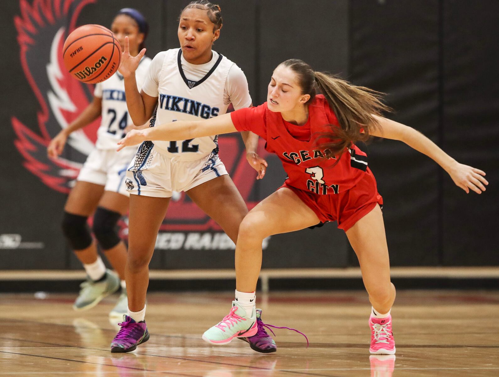 Monet Parker (12) of Atlantic City steals the ball from Allie Hudson (3) of Ocean City during the girls basketball game between Ocean City and Atlantic City at Ocean City High School in Ocean City, NJ on 1/14/26.