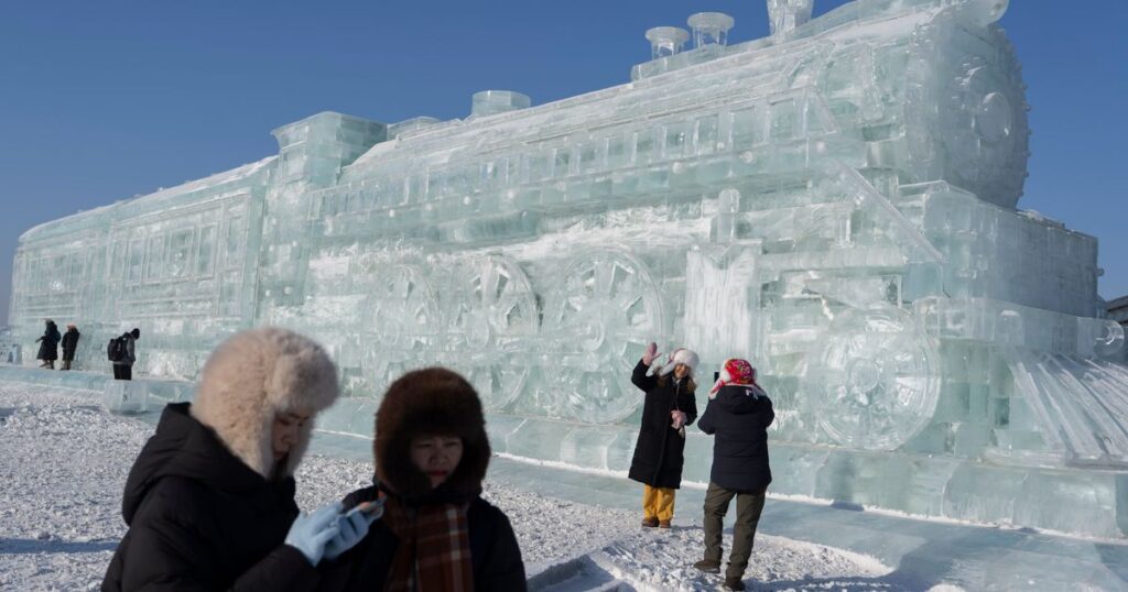 Harbin ice festival draws sculptors and spectators to northern China, in photos