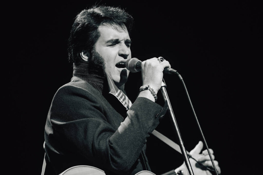 Travis Powell, an Elvis tribute artist, performs during “1969 Live Concert: The King Ret ...