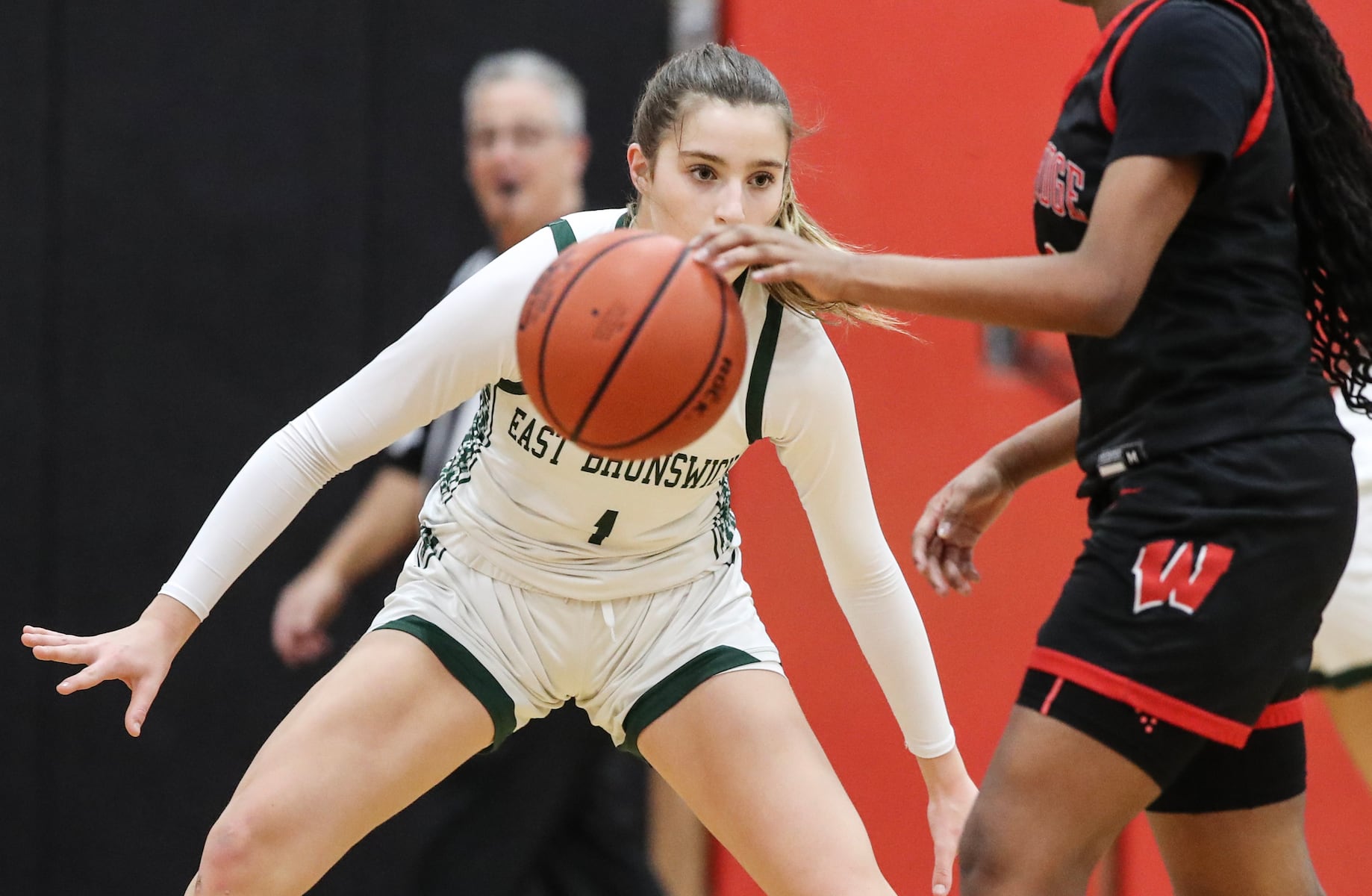 Ava Catanho (1) of East Brunswick defends against Angel Smith (11) of Woodbridge during the girls basketball game between Woodbridge and East Brunswick at Woodbridge High School in Woodbridge, NJ on 2/2/26.