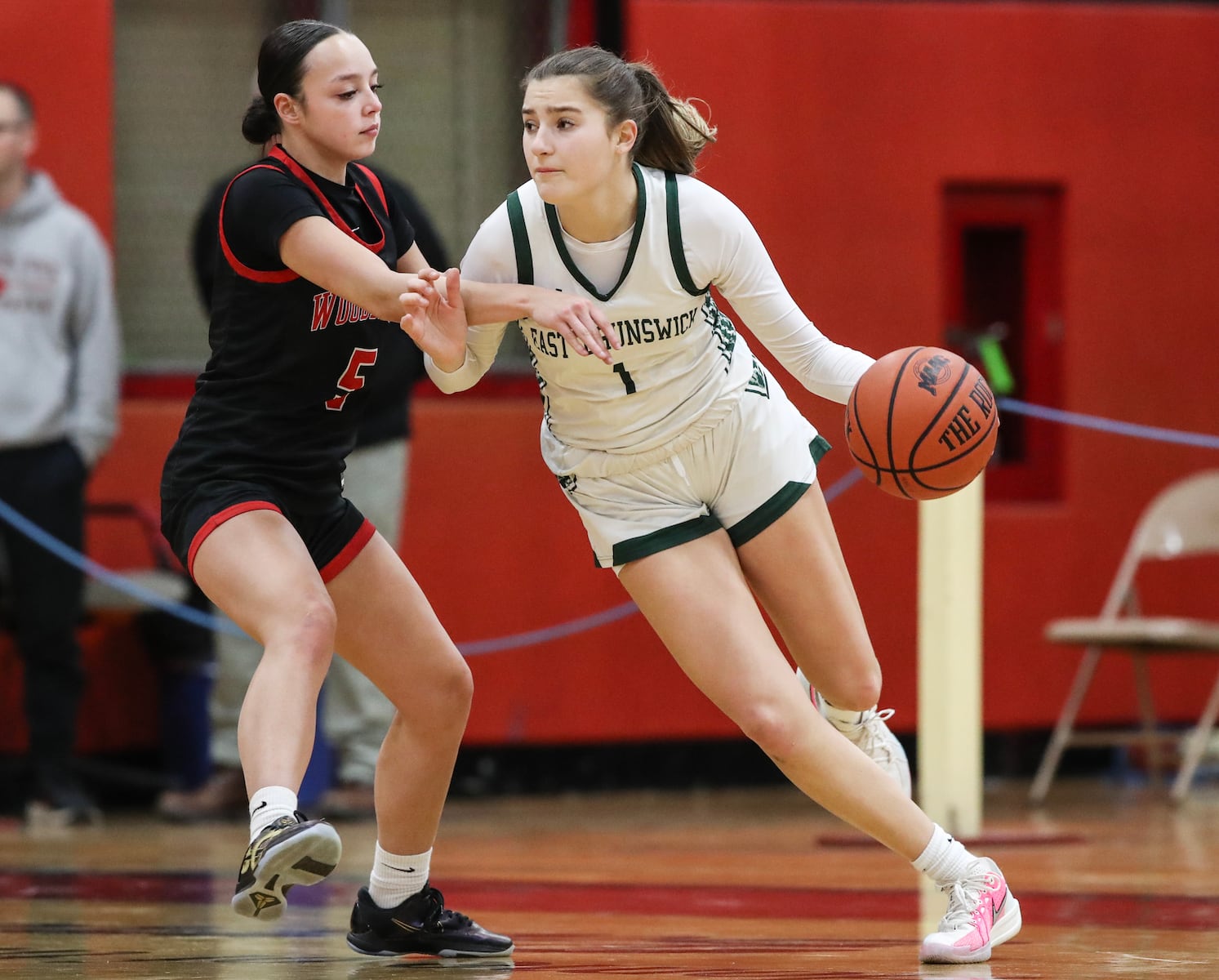 Ava Catanho (1) of East Brunswick drives against Layla Mercado (5) of Woodbridge during the girls basketball game between Woodbridge and East Brunswick at Woodbridge High School in Woodbridge, NJ on 2/2/26.