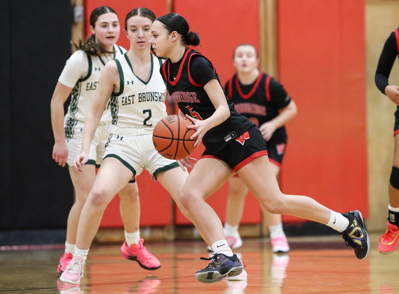 Layla Mercado (5) of Woodbridge dribbles against Makenna Gay (2) of East Brunswick during the girls basketball game between Woodbridge and East Brunswick at Woodbridge High School in Woodbridge, NJ on 2/2/26.